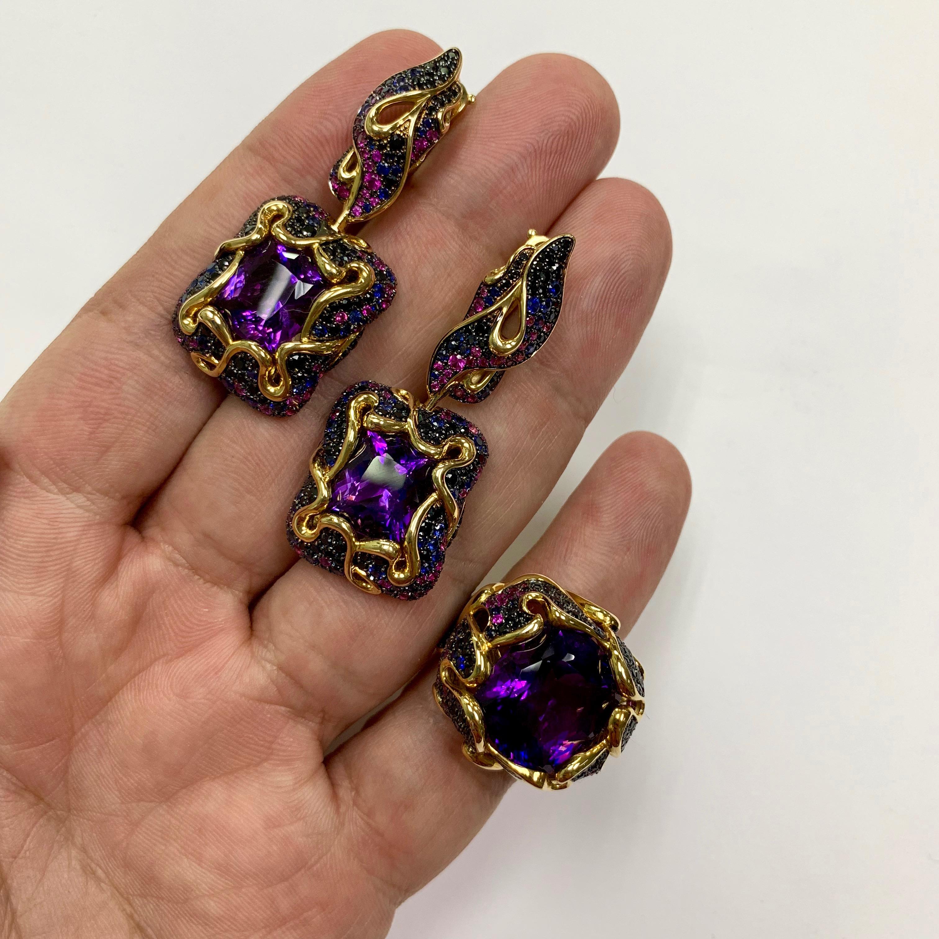 Amethyst Pink Blue Black Sapphire 18 Karat Yellow Gold Ring Earrings Suite
In early June in the gardens bloom luxurious flowers - peonies. Romance and mystery of peonies always attracted and allured artists. Our designers created this Suite,
