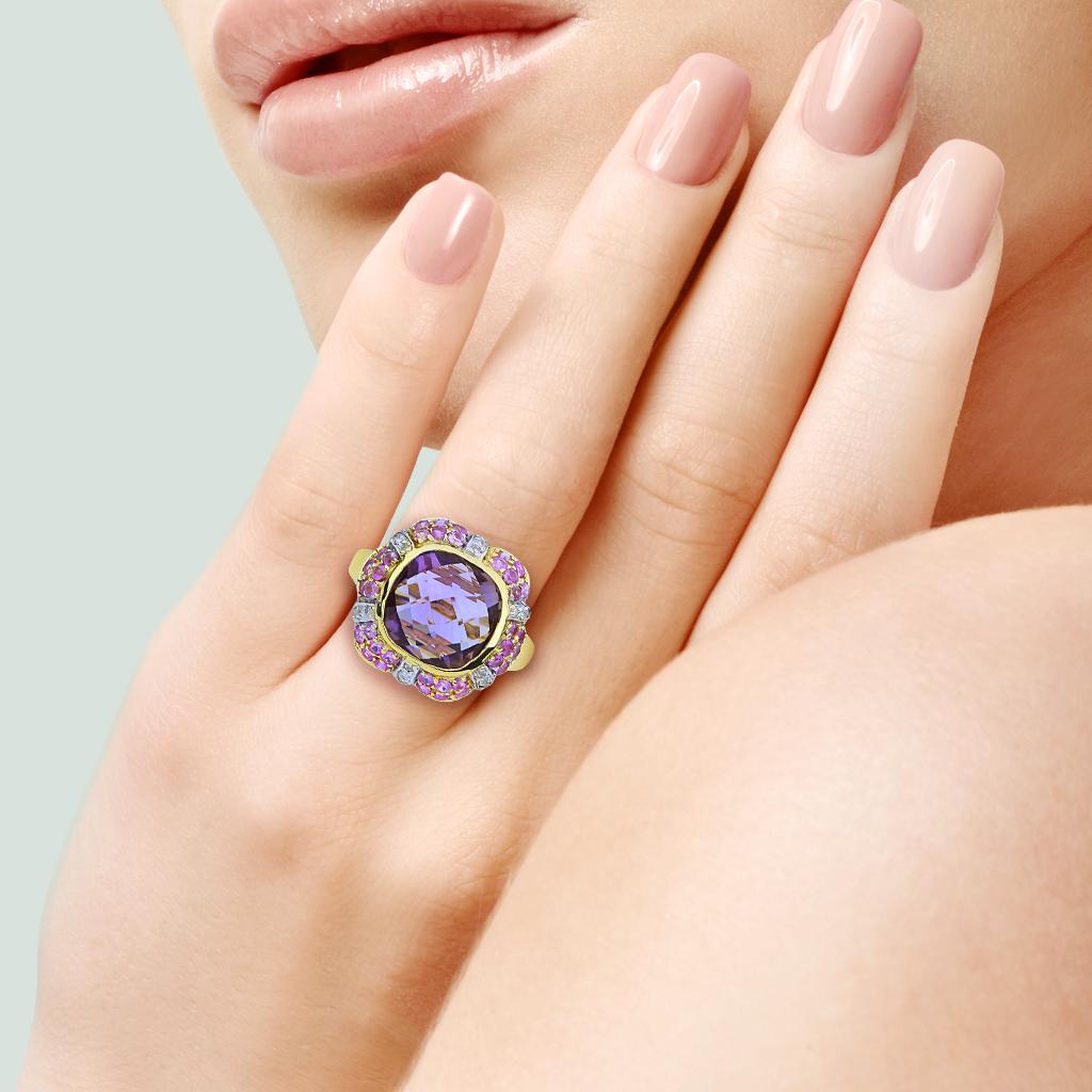 This lavender colored checkerboard cushion amethyst is nested perfectly in a halo of pink sapphires and eye catching diamonds in a 14K yellow gold setting.

Hallmarks: 14K, Makers Mark

Center Gemstone
Gemstone: Amethyst
Carat Weight: 3.90 ct
Shape: