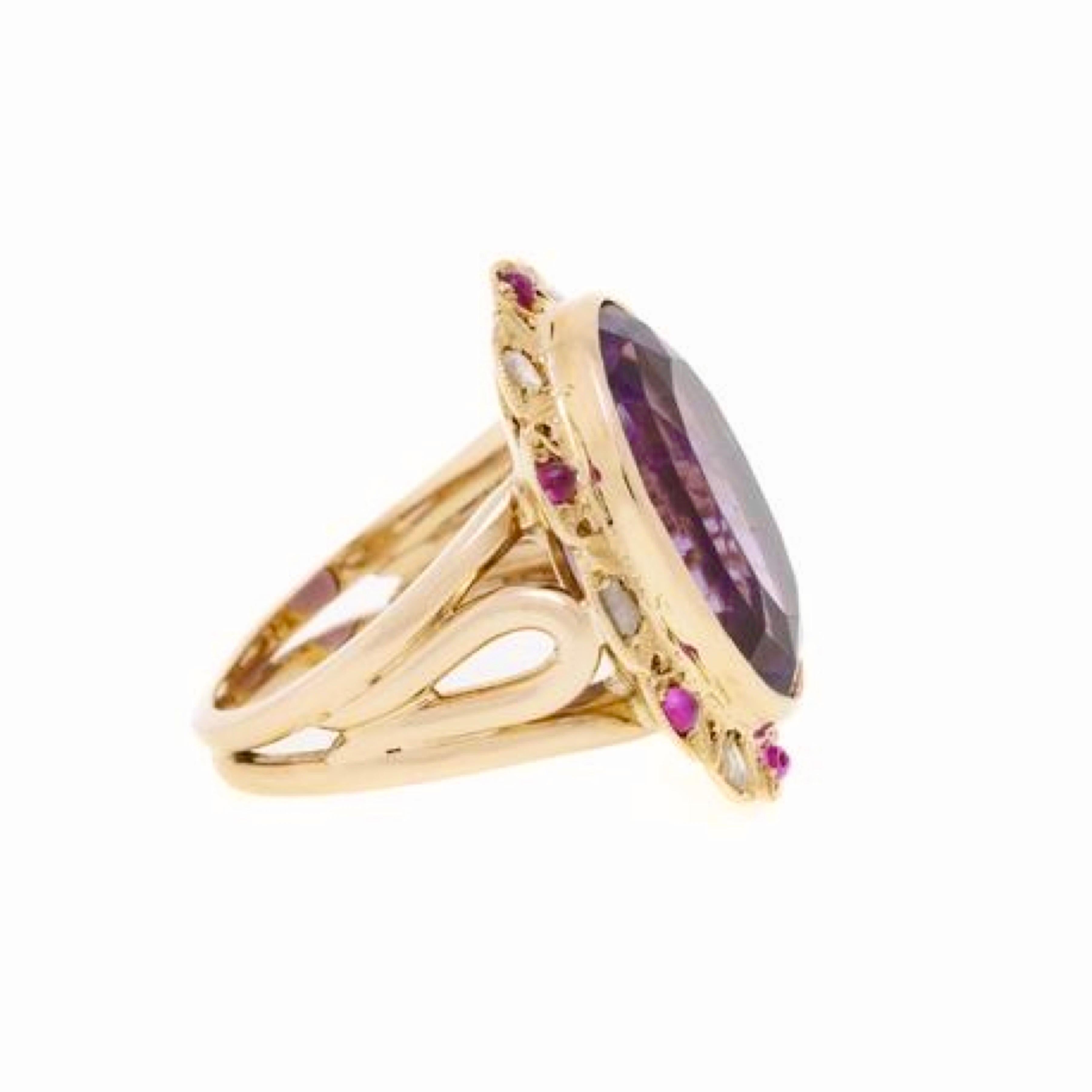 A pompadour ring set with an oval cut amethyst surrounded by cabochons of pink sapphires and rose cut diamonds on pink gold.

Estimated weight of the amethyst : 8.40 carats

Dimensions : 19.81 x 23.56 x 7.49 mm (0.779 x 0.927 x 0.295 inch)

Total