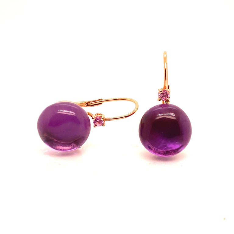Earrings of amethyst balls overcome with pink sapphires mounted on a sleeping frame of 18 karat rose gold
2.8 grams of gold
total weight 7.7 grams for both
Hauteur 2,5 centimètre 
0.985 inch