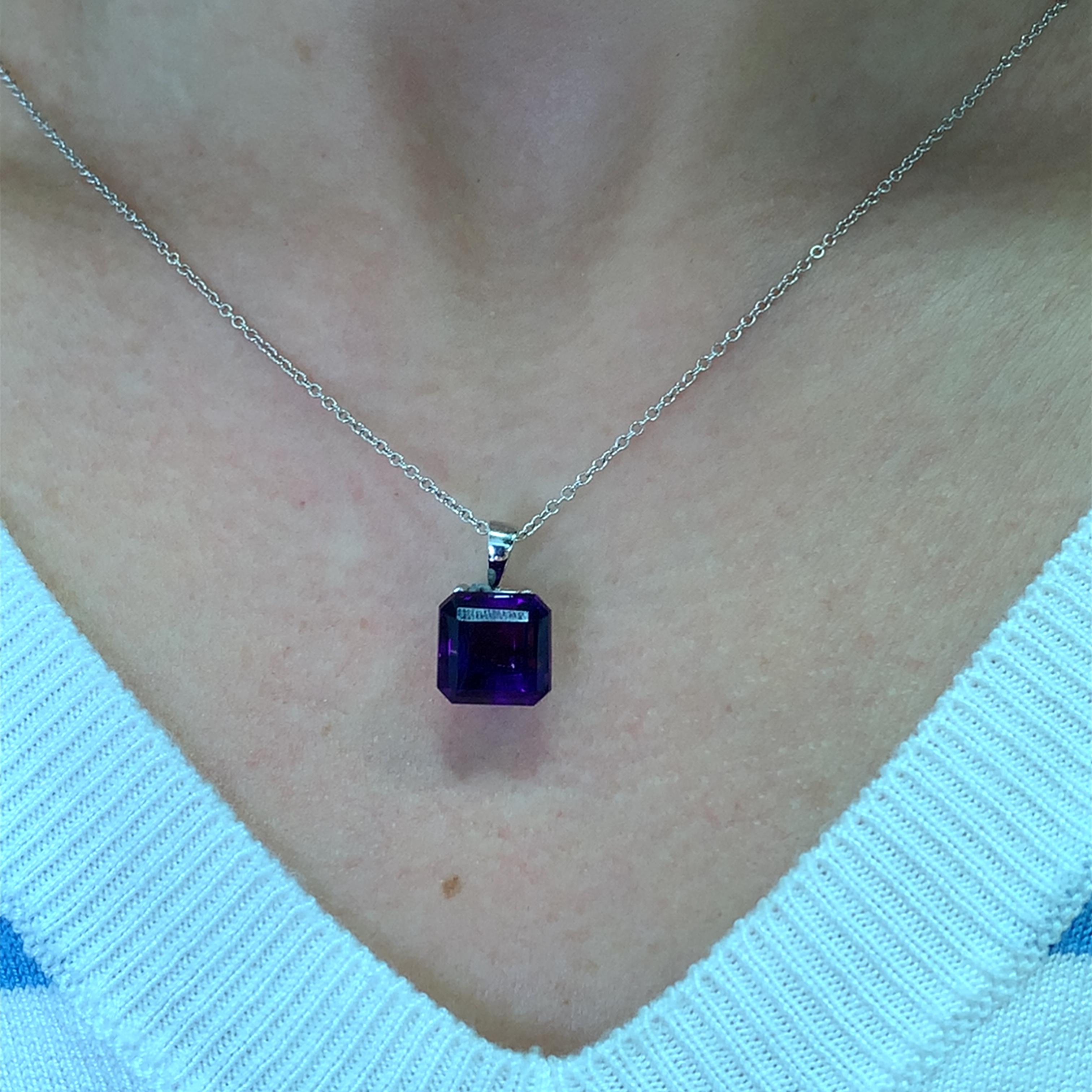 This stunning amethyst 5.80ct  pendant necklace features a beautifully cut square gemstone that radiates elegance. The rich purple hue of the amethyst measuring 11mm is complemented by a delicate 18k gold chain, making it a perfect accessory for any