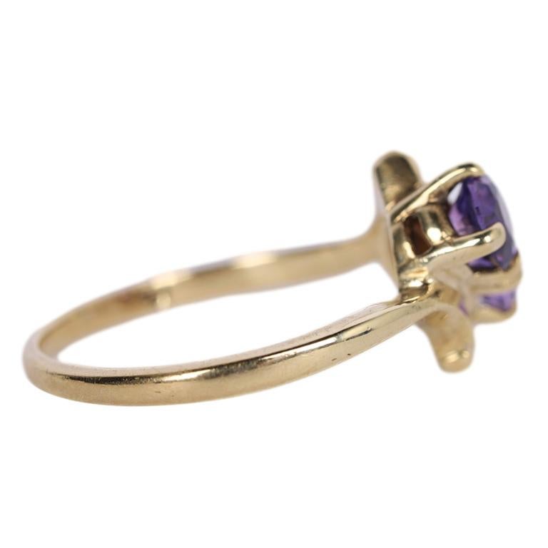 10KT Gold Purple Amethyst Double Round Stone Ring

This beautiful ring has two bright beautiful amethyst round stones set in 10 kt gold. Would make a beautiful right hand ring or engagement ring. Each stone measures a approx. .50 carats for a total