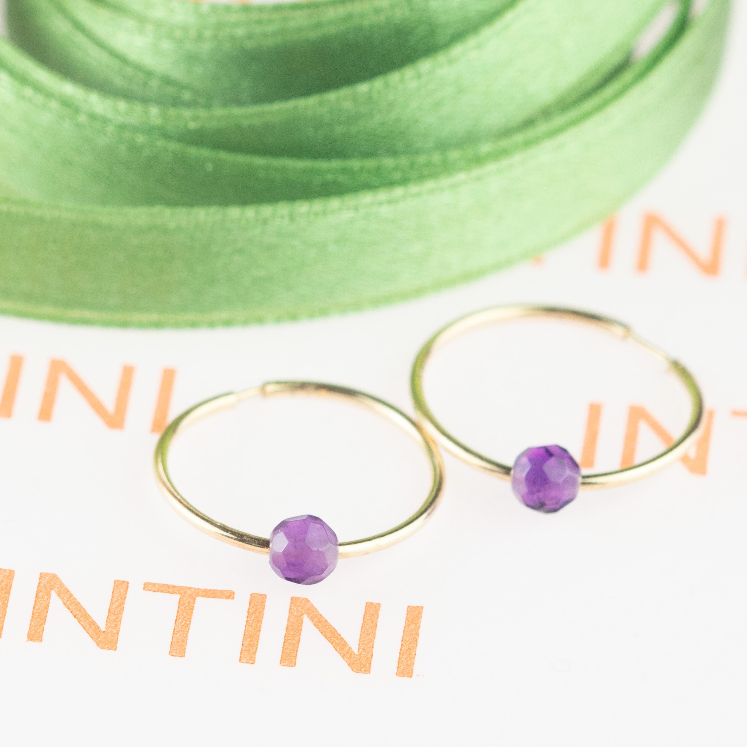 Signature INTINI Jewels planet earrings. Contemporary earring design in 18k yellow gold with a precious and luminous Amethyst rondelles. Passion and intensity mixed in one jewel. Delight yourself with a strong, minimalist design, just for a stunning