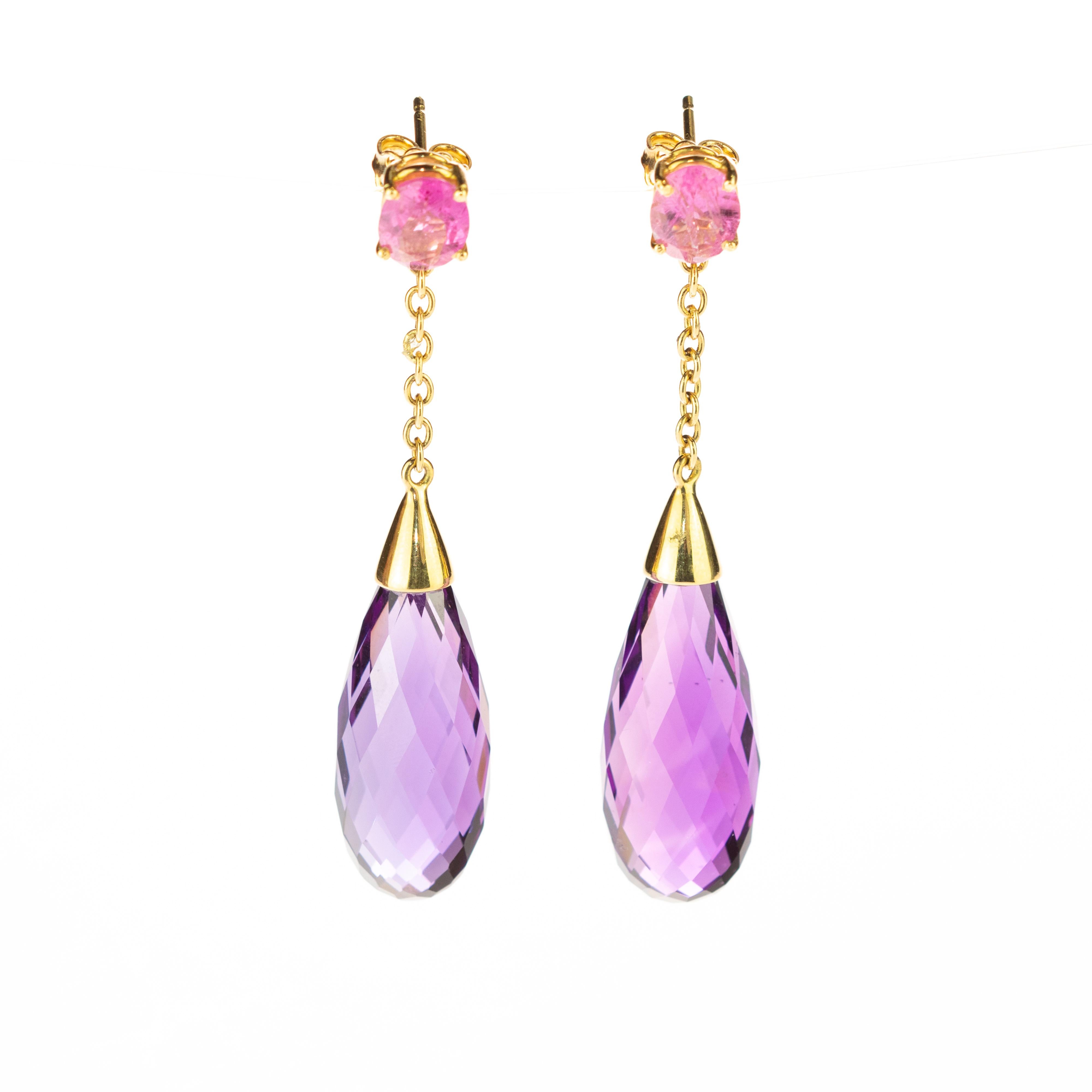 An enchanted radiant pink earrings held by 18 karat gold delicated chain to a deep purple amethyst tourmaline tear. Modern tear designs jewels that combine voluminous shapes with vivid colours, resulting in bold, free-spirited pieces with a charming