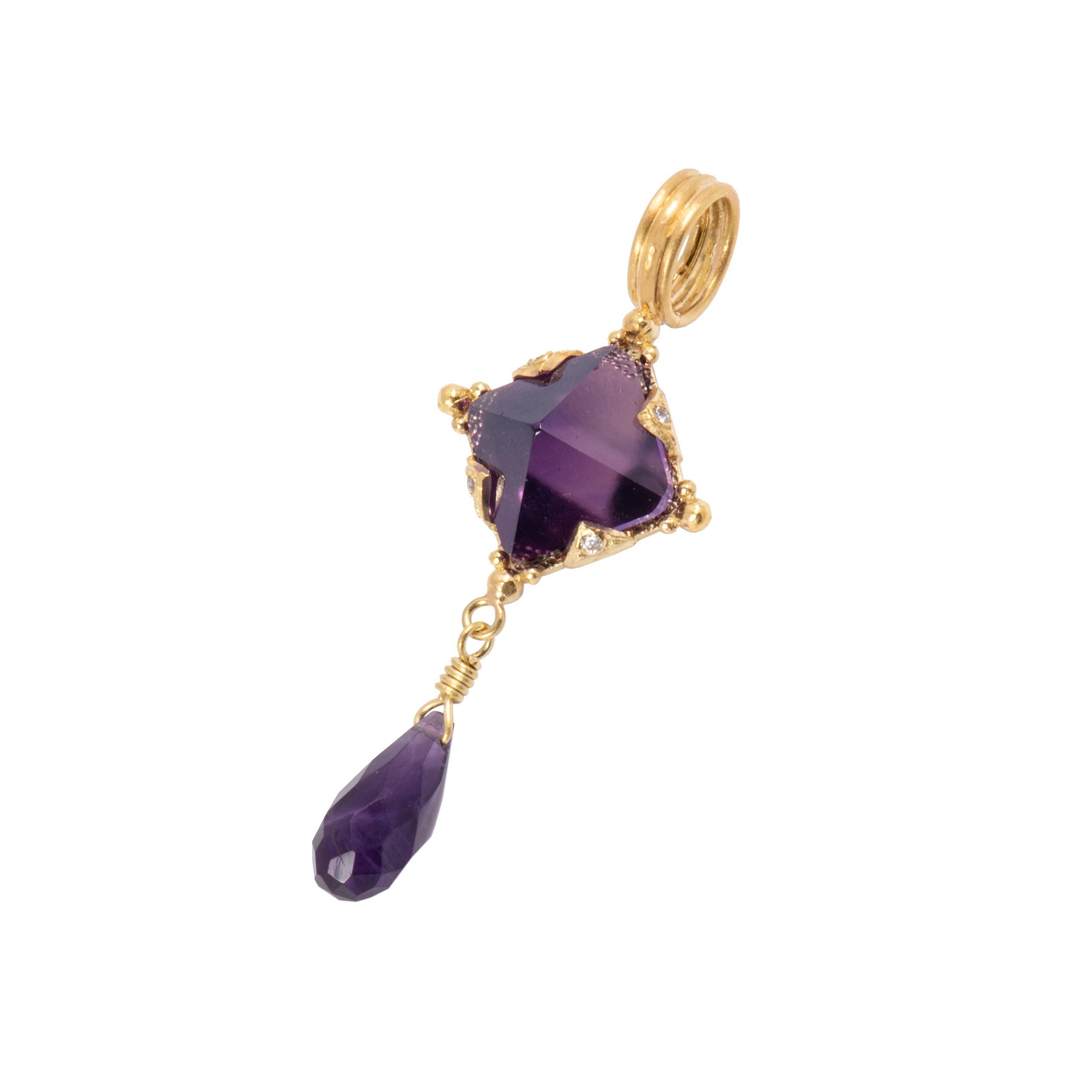 The Amethyst Pyramid Pendant in 18 Karat Gold features a deeply colored stone with 4 facets that catch and reflect the light like window panes. Set in 18k gold with beading, and decorative settings set with 4 sparkling round white diamonds, the