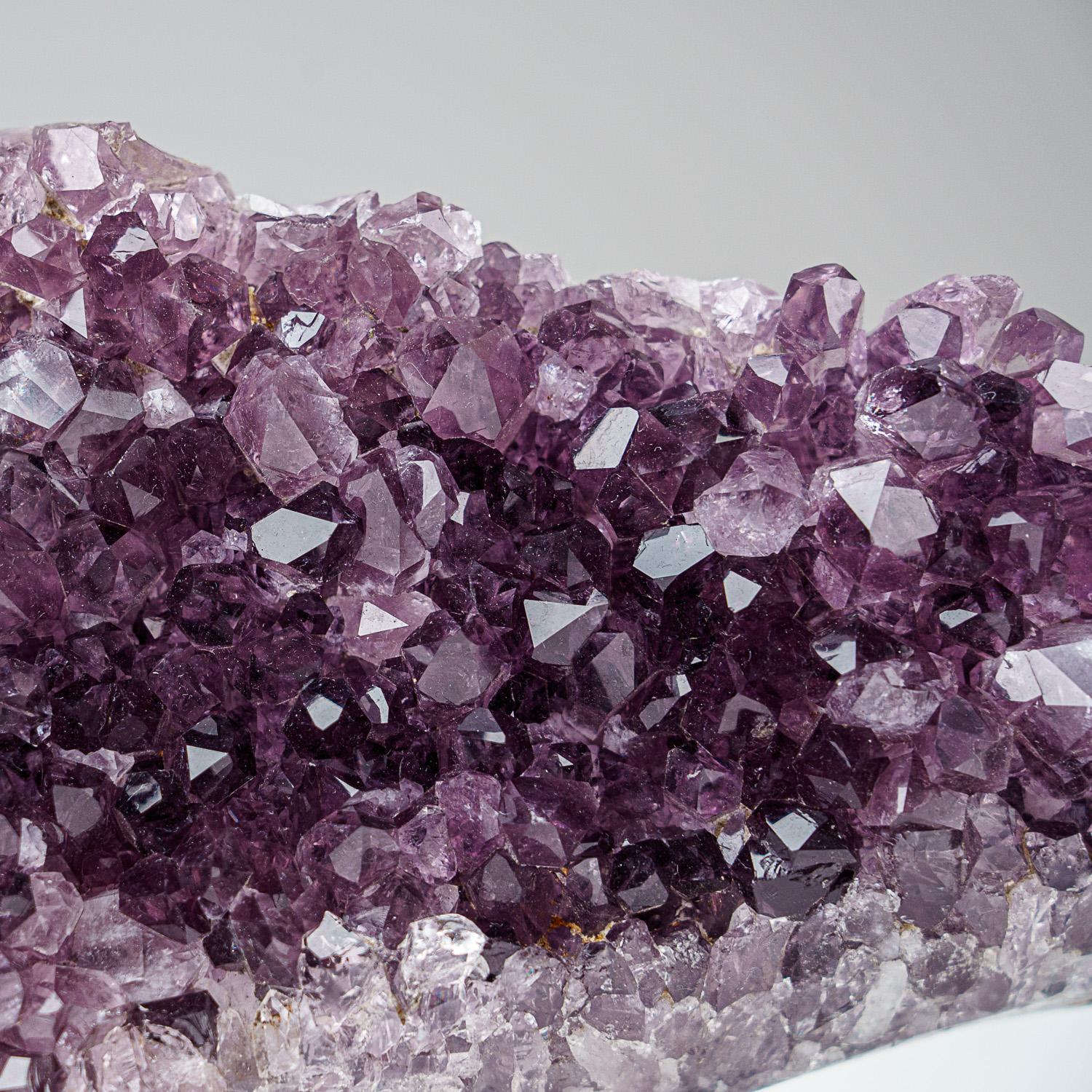 AAA Top Quality natural formation of gem amethyst variety quartz cluster with lustrous fully terminated crystals with highly reflective faces and deep transparent to translucent grape color.

Amethyst opens and activates the Crown Chakra as well,