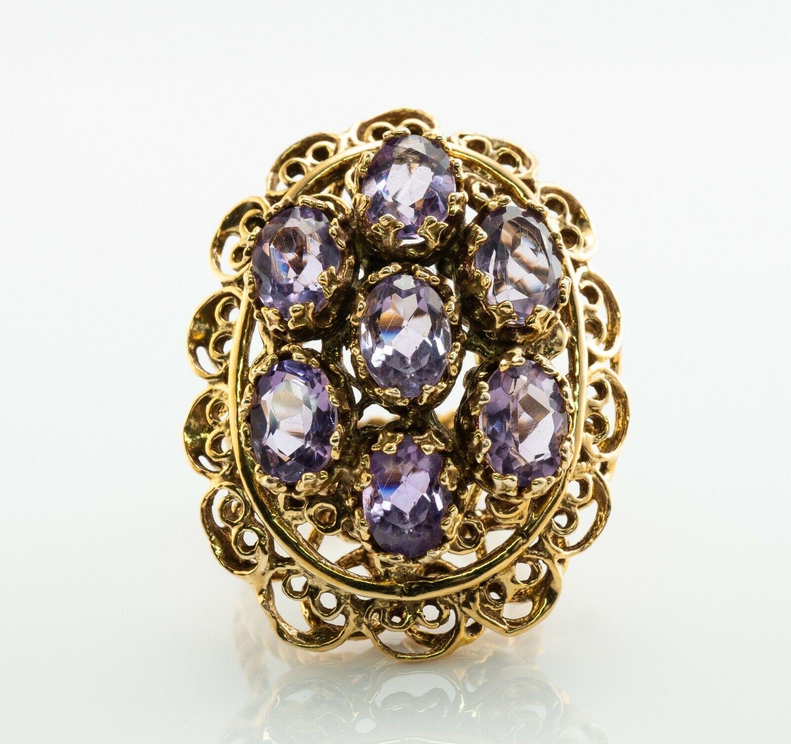 Bague Améthyste 14K Or Cocktail Vintage Estate

Cette magnifique bague vintage est finement fabriquée en or jaune 14 carats massif (soigneusement testé et garanti) et sertie d'améthystes authentiques extraites de la terre. 
Sept pierres précieuses