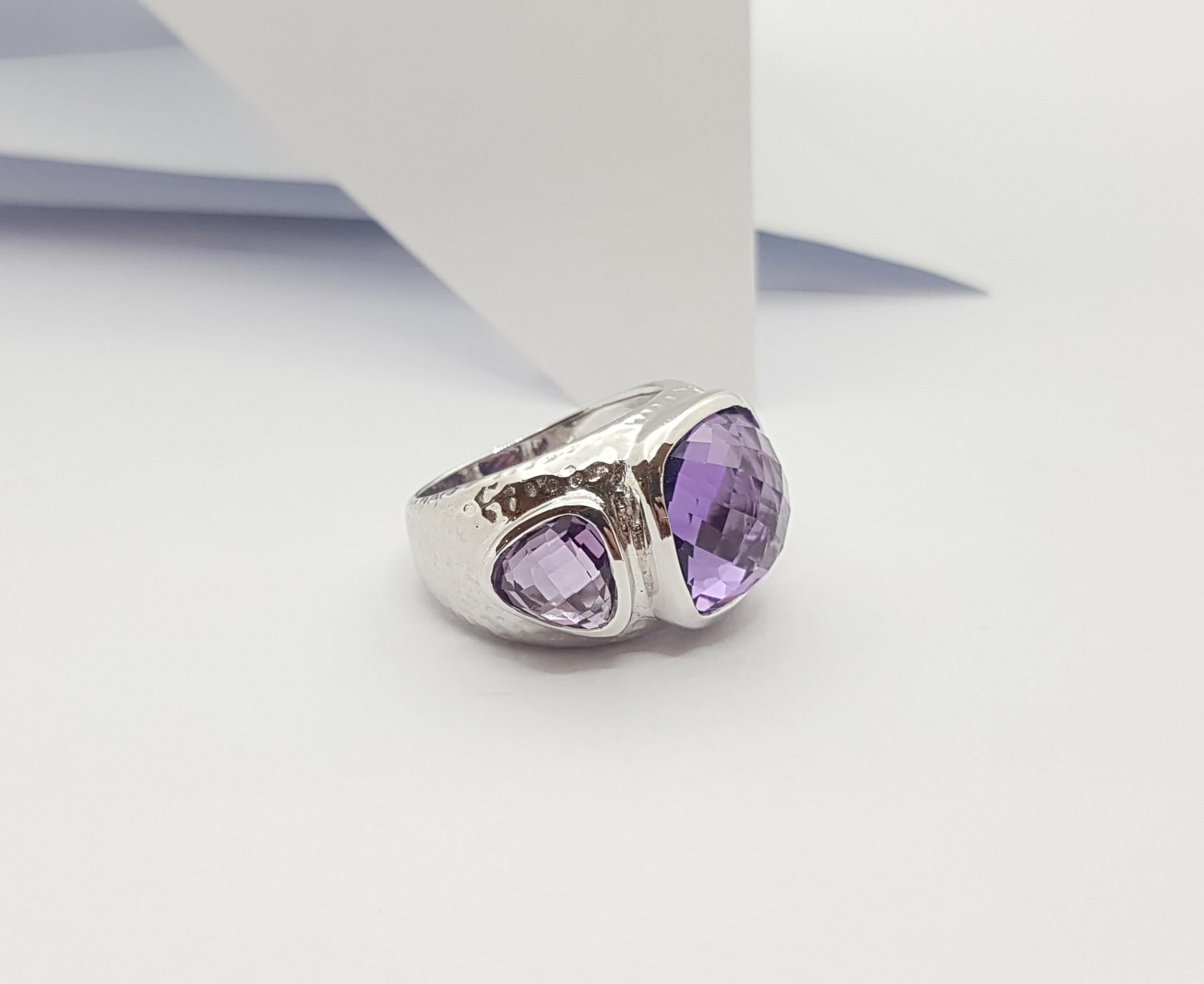 Amethyst 9.09 carat Ring set in Silver Settings

Width:  2.4 cm 
Length: 1.3 cm
Ring Size: 53
Total Weight: 10.45 grams

*Please note that the silver setting is plated with rhodium to promote shine and help prevent oxidation.  However, with the