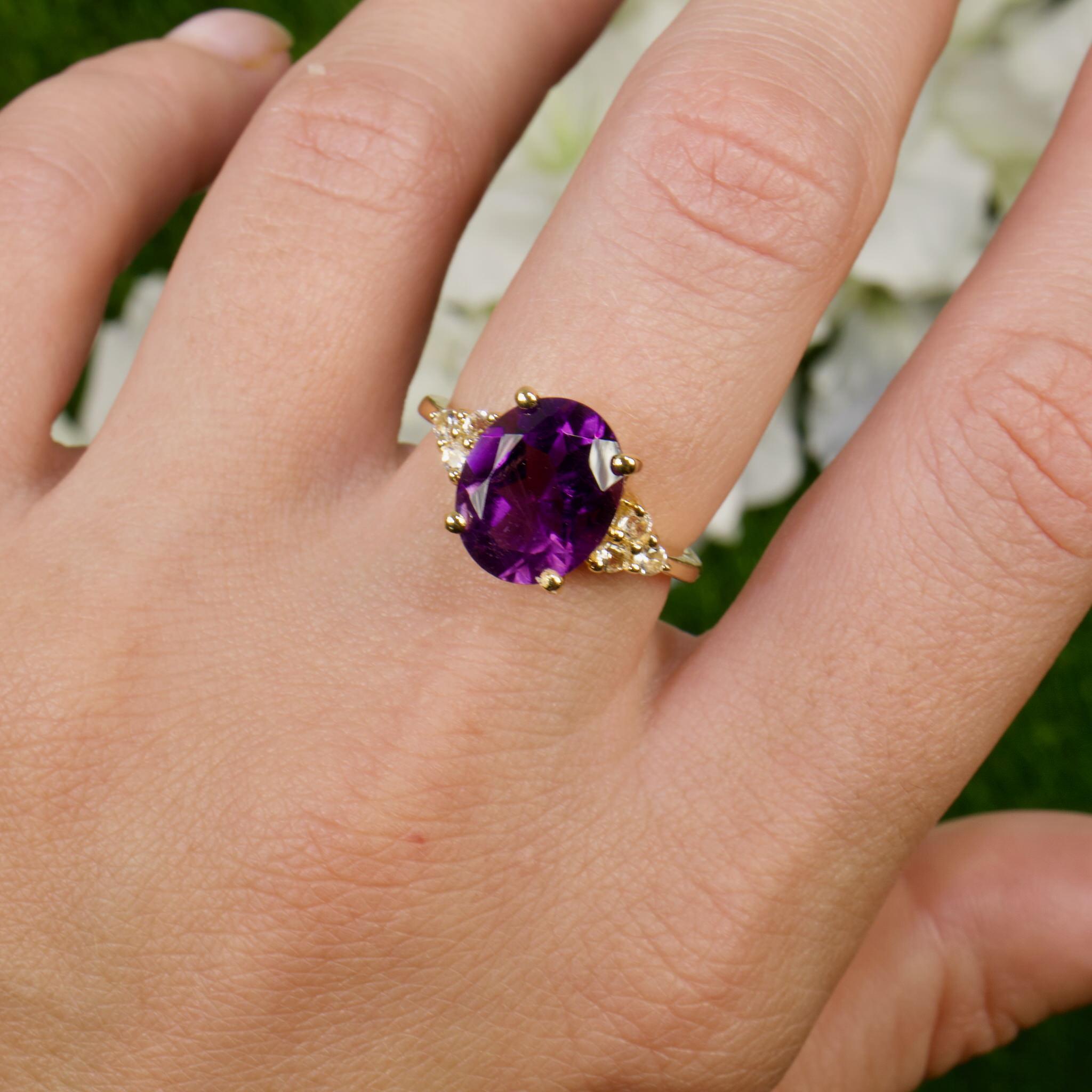 It comes with the Gemological Appraisal by GIA GG/AJP
All Gemstones are Natural
Amethyst = 3.20 Carats
Cut: Oval
6 Round Cut White Topazes = 0.23 Carats
Metal: 14K Yellow Gold Plated Sterling Silver
Ring Size: 7* US
*It can be resized complimentary