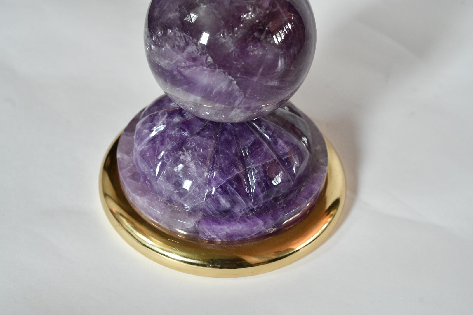 Pair of amethyst rock crystal quartz lamps with fine cast gilt brass base. Created by Phoenix Gallery NYC.
Measure: To the top of the rock crystal 22