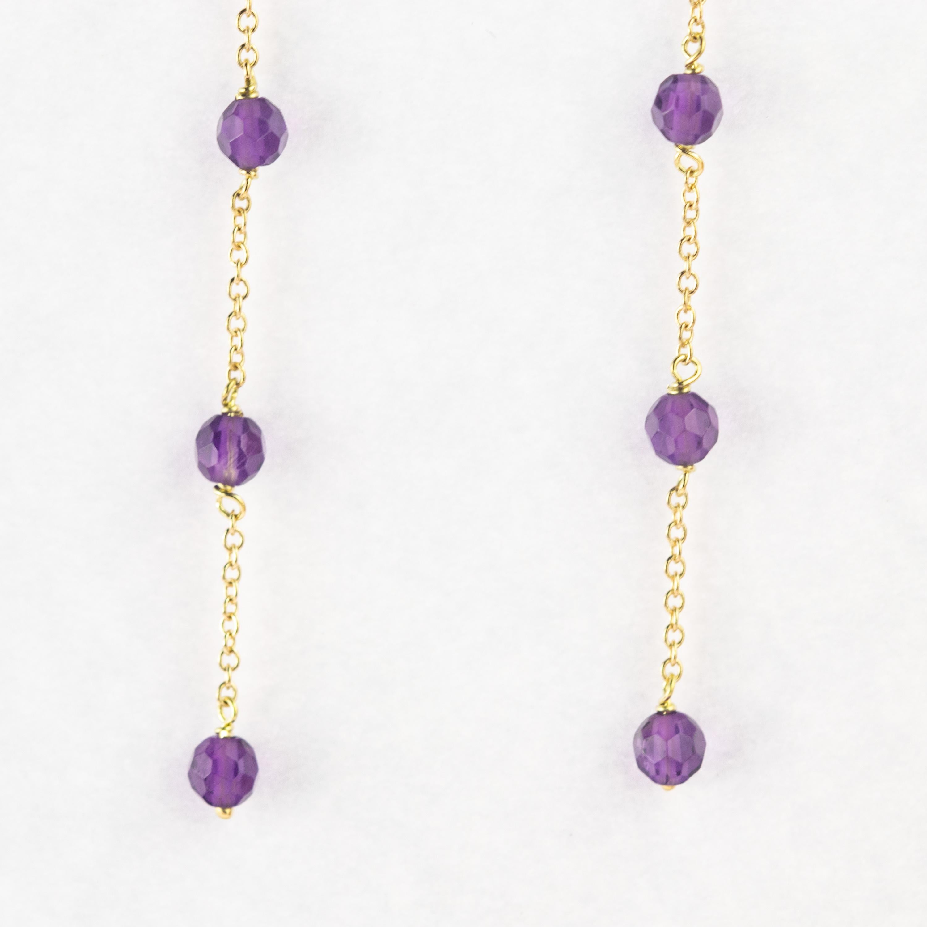 Intini Jewels signature quality on a modern and contemporary design jewel. Stunning long and dangle earrings with three amethyst beads. Embellished with a  Gold Plate chain will make you look beautiful and full of charm. Vintage and long drop