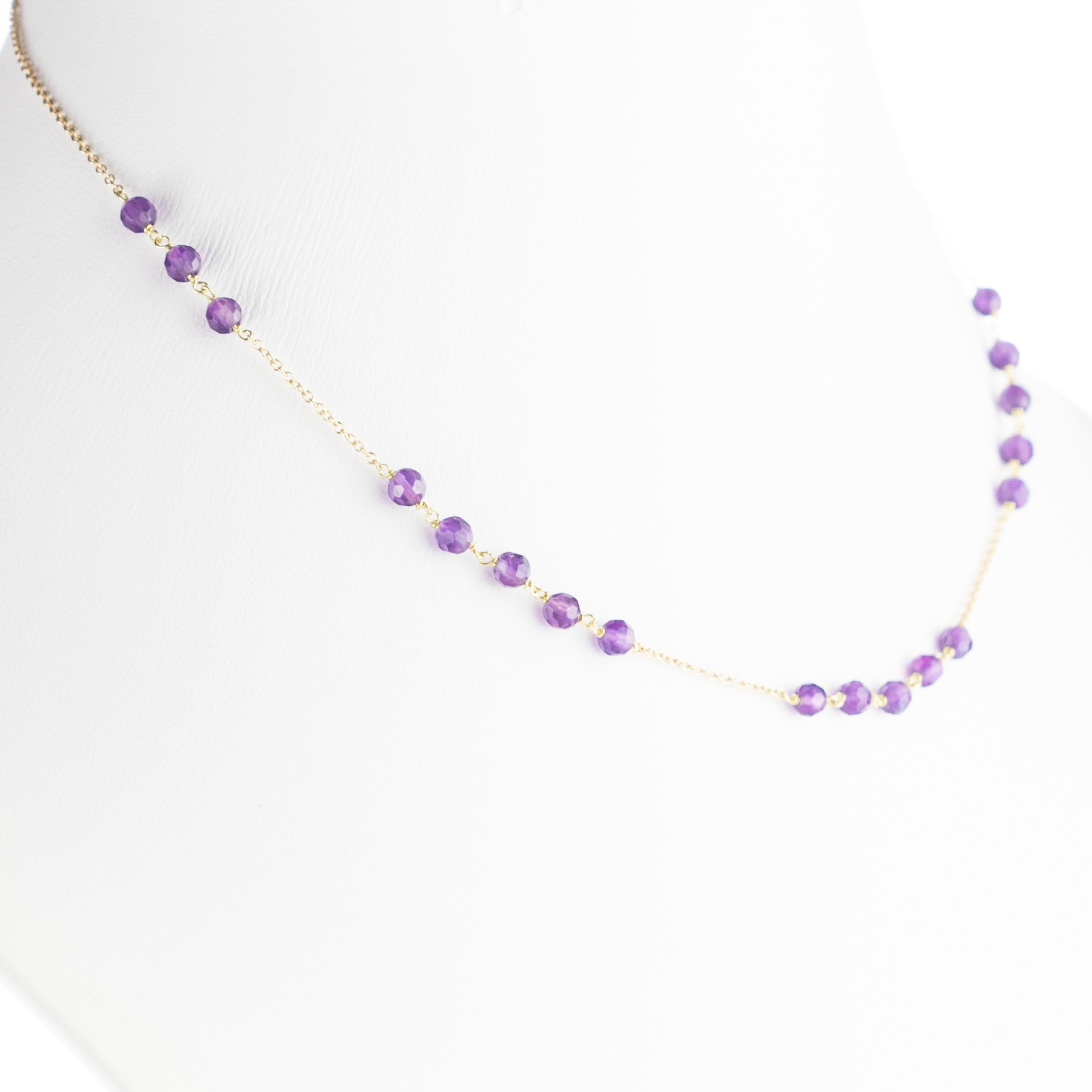Marvellous necklace starring natural amethyst beads, for a bright charm of uniqueness. Luminous jewel with natural precious jewellery on elegant 9 karat yellow gold setting.

Amethyst is marked as the stone for the month of February. Amethyst is the