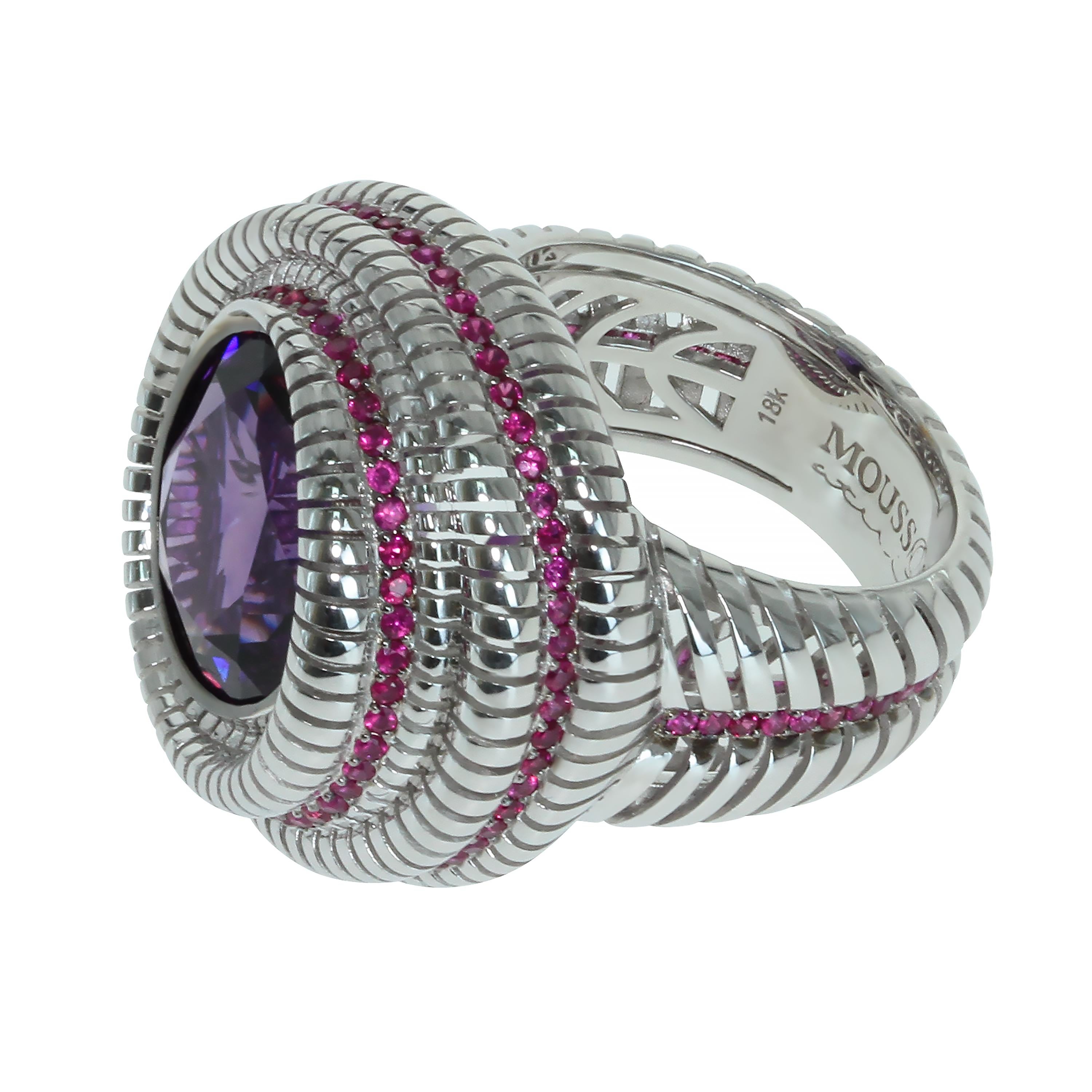 Amethyst Ruby 18 Karat White Gold Ring

Unusual form of 18k White Gold binds as a chain this astounding round shaped 8.08 carat amethyst. And line of 151 glittering Rubies perfectly combines with this duet. This is the kind of ring one wears to make