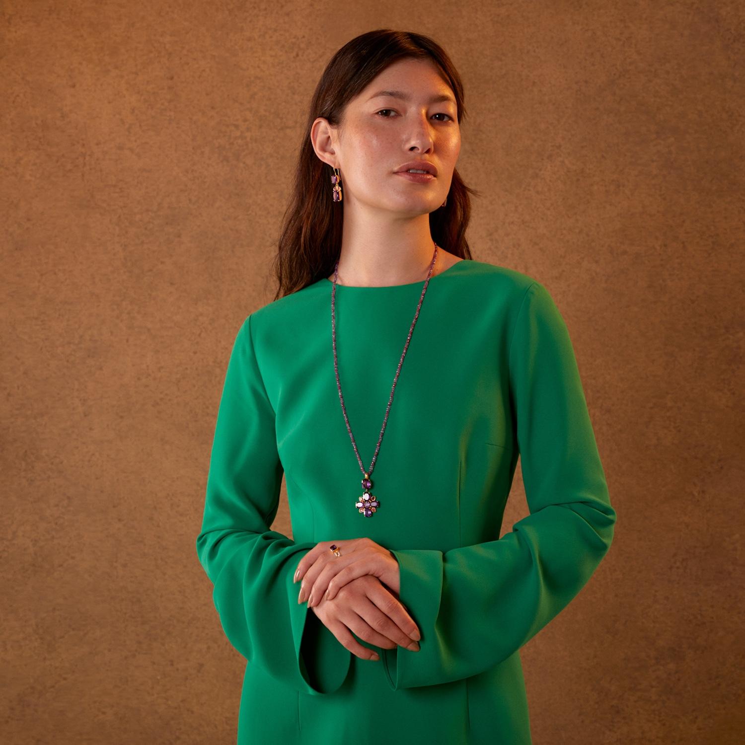 

This limited edition statement amethyst ruby cross pendant has been handmade in our workshops. It features hand-cut amethysts which are embedded with rubies set in hand-engraved motifs. The pendant which was launched at London Fashion Week, is