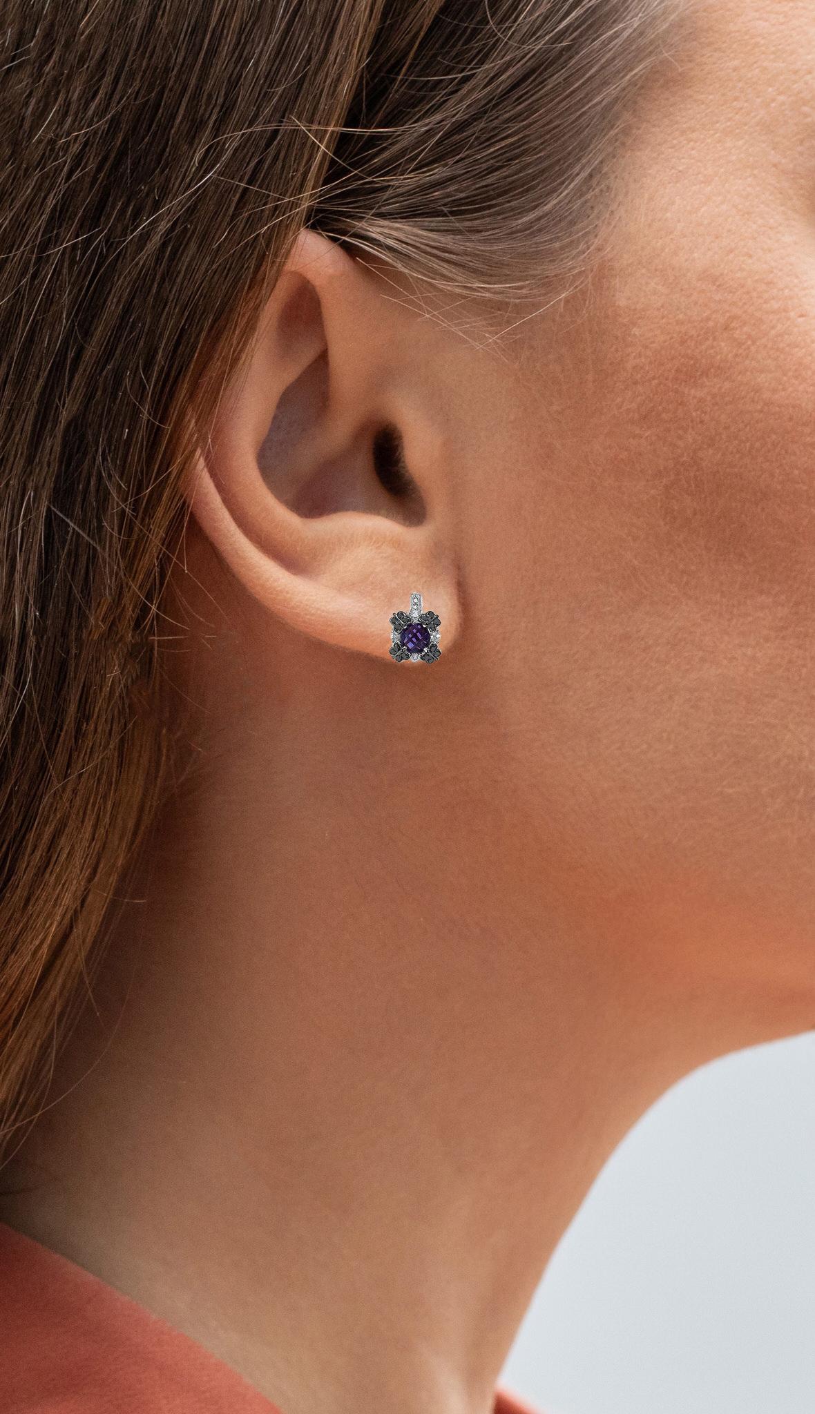 It comes with the Gemological Appraisal by GIA GG/AJP
All gemstones are natural
2 Amethysts = 1.75 Carats
16 White Sapphires = 0.75 Carats
16 Black Diamonds = 0.10 Carats
Metal: Rhodium Plated Sterling Silver
Dimensions: 8 x 6 mm