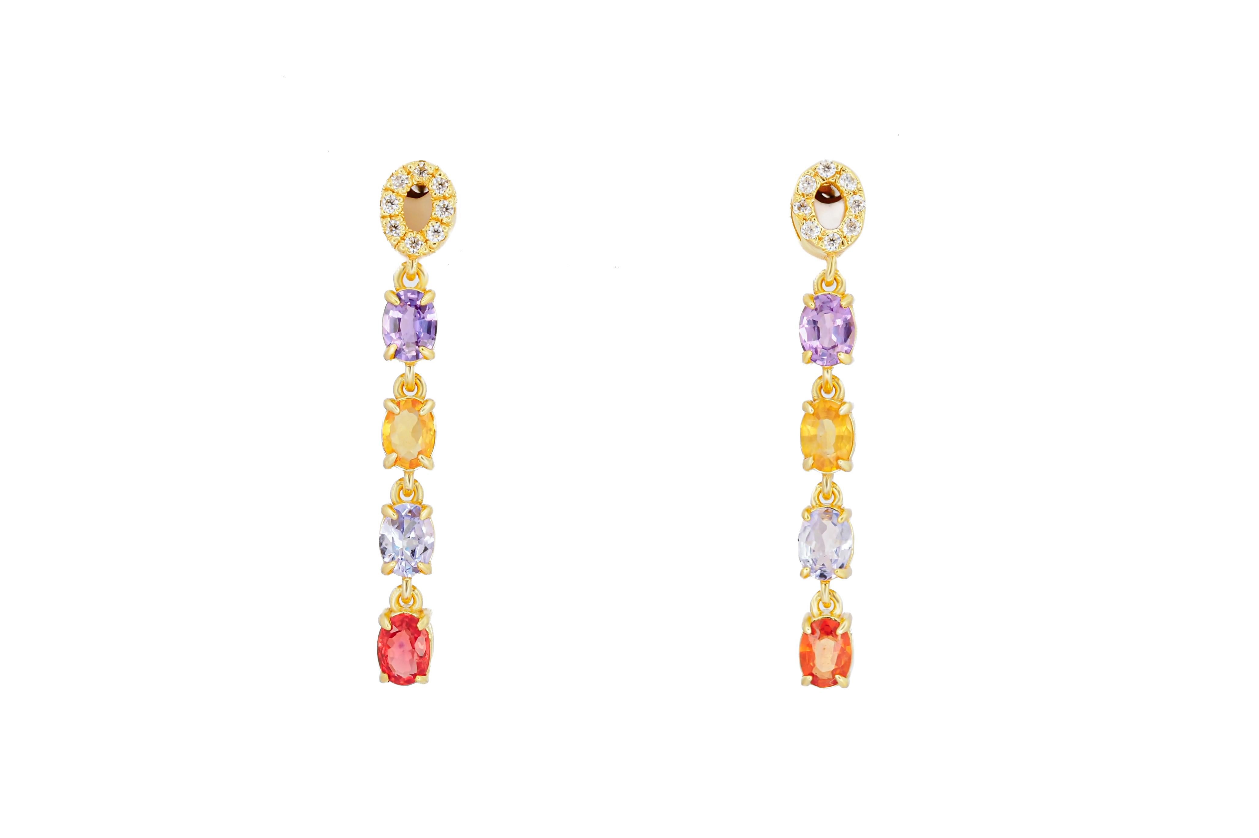 Amethyst, sapphire, tanzanite, diamonds earrings studs in 14k gold. Yellow, orange sapphire 14k gold earrings. Tanzanite gold earrings.  Four color dangle earrings.  Multicolor gems long earrings.

Metal: 14k gold
Weight: 2.8 gr
Earrings size: