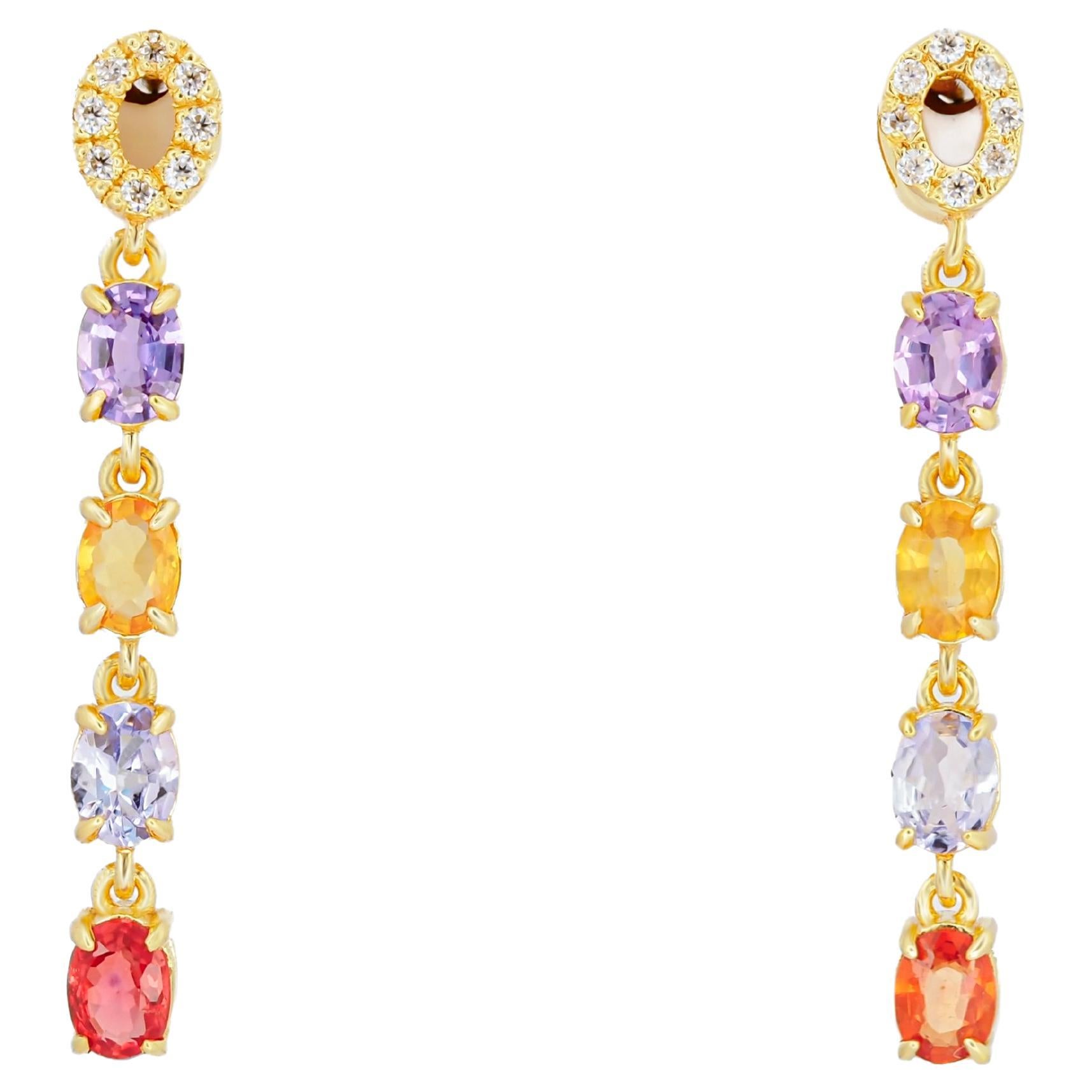 Amethyst, sapphire, tanzanite, diamonds earrings studs in 14k gold.  For Sale