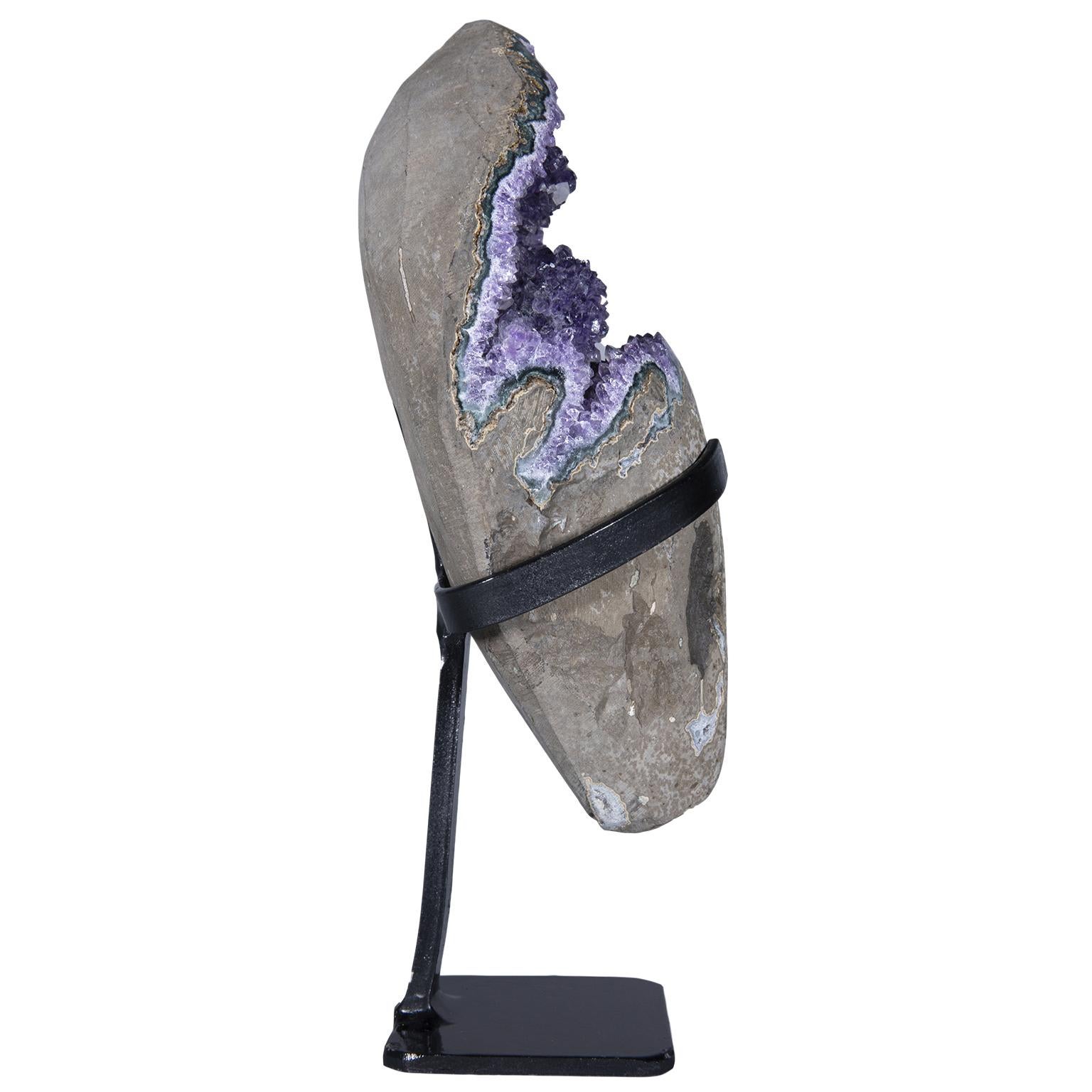A stunning rough amethyst sculpture with calcite crystals.

The exquisite amethyst cluster has an exquisite deep purple color combined with green celadonite, blue-grey agate and white quartz.

To further add to its beauty, this piece has calcite