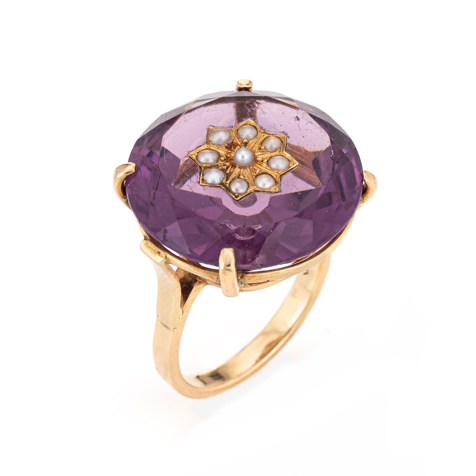 Stylish vintage amethyst & seed pearl ring (circa 1950s to 1960s) crafted in 14 karat yellow gold. 

Round faceted amethyst measures 21mm diameter (estimated at 23 carats). The 9 seed pearls each measure 1.5mm. The amethyst is in very good condition