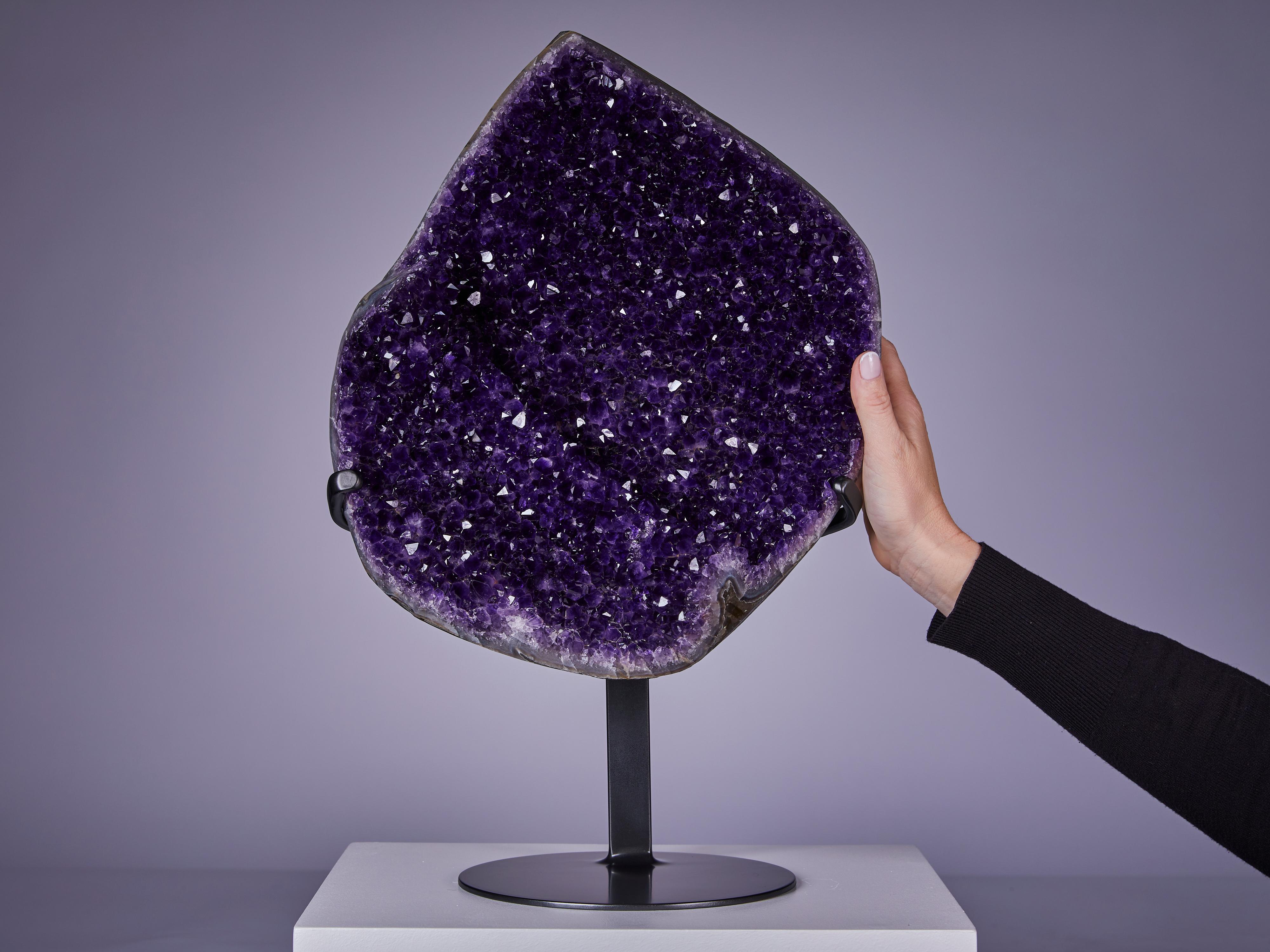 Beautiful section of an amethyst geode, unusually thin in cross section and resembling a shell with gorgeous deep purple amethyst lining.
Origin : Artigas, Uruguay




