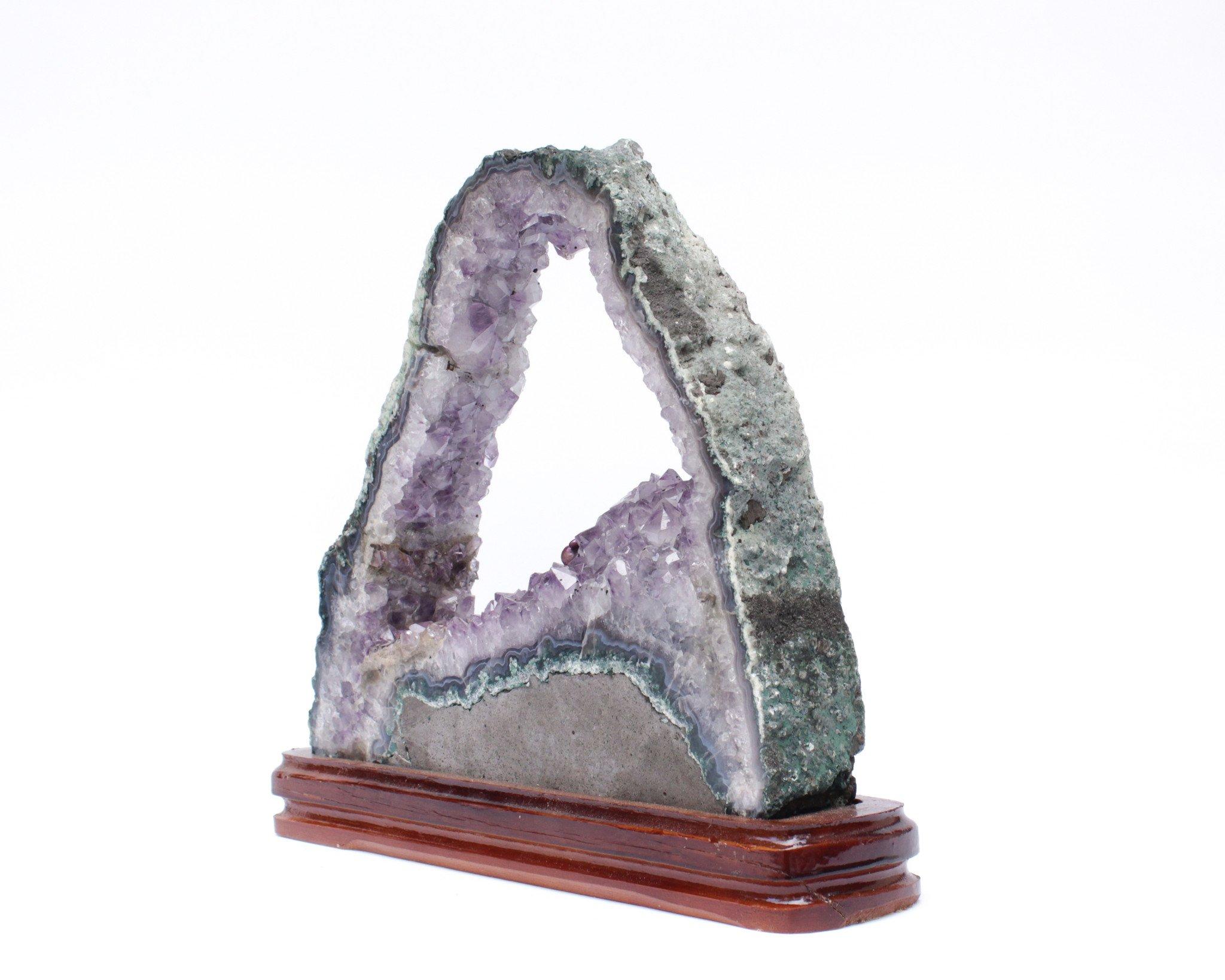 Hand-Carved Amethyst Slice with a Baroque Pearl on a Polished Wood Base For Sale