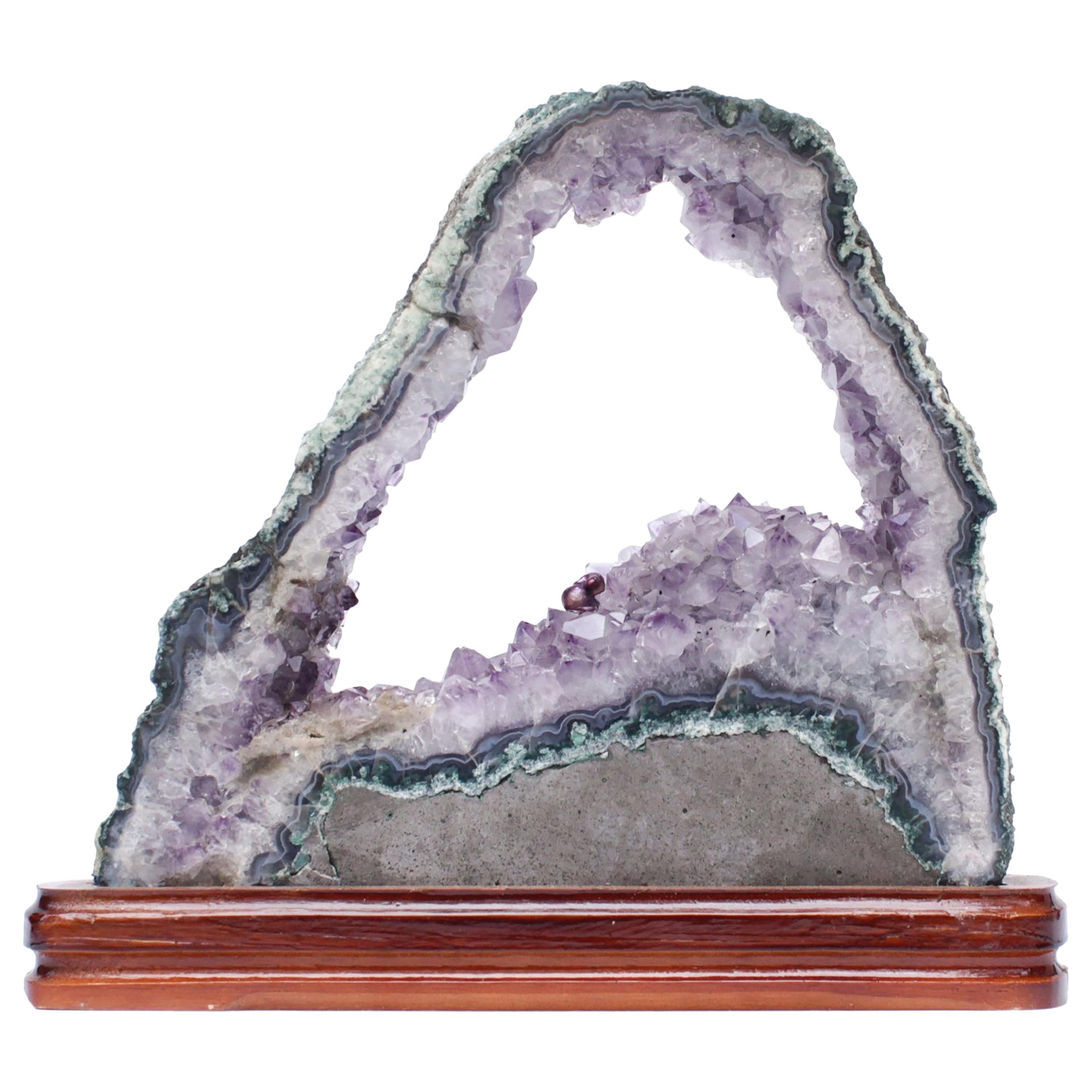 Amethyst Slice with a Baroque Pearl on a Polished Wood Base