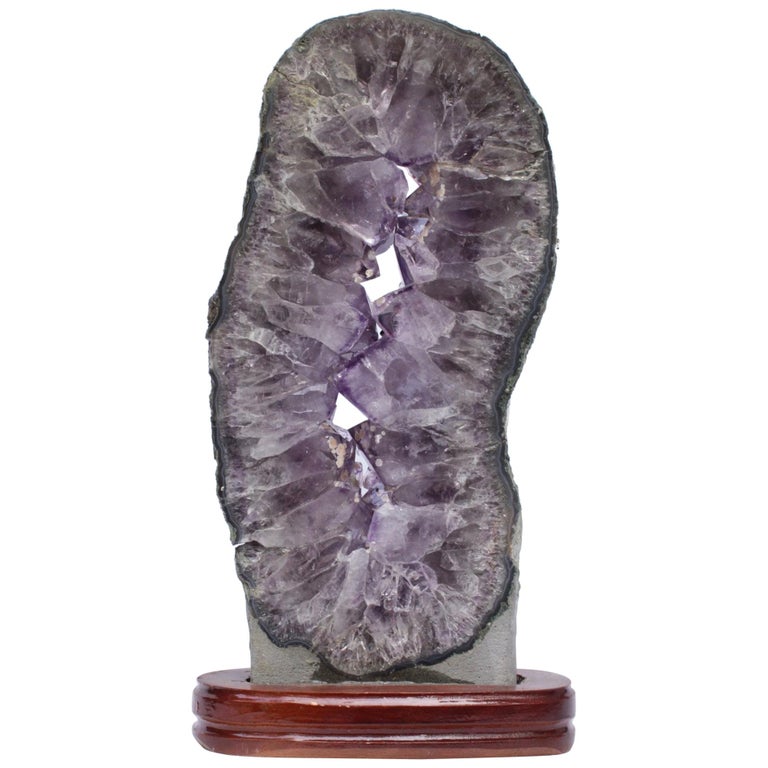 Amethyst Slice with Calcite Deposits and a Baroque Pearl on a Polished Wood Base For Sale