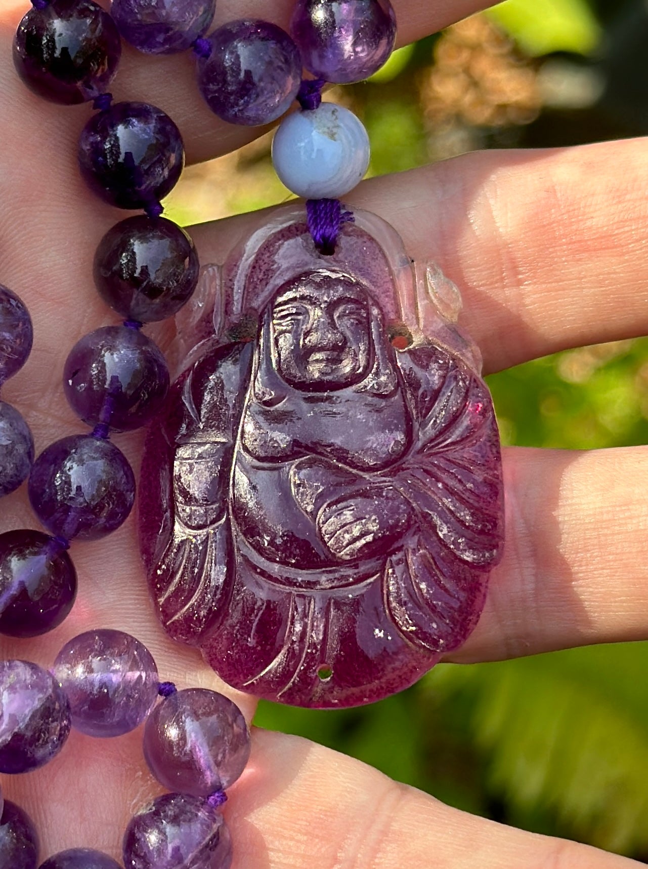 This is a wonderful antique carved Amethyst Smiling Fat Buddha Pendant on a magnificent necklace of natural Amethyst Beads of 27 inches in length. The Buddha is exquisitely carved in natural Amethyst.  The Buddha with his radiant smile and Fat