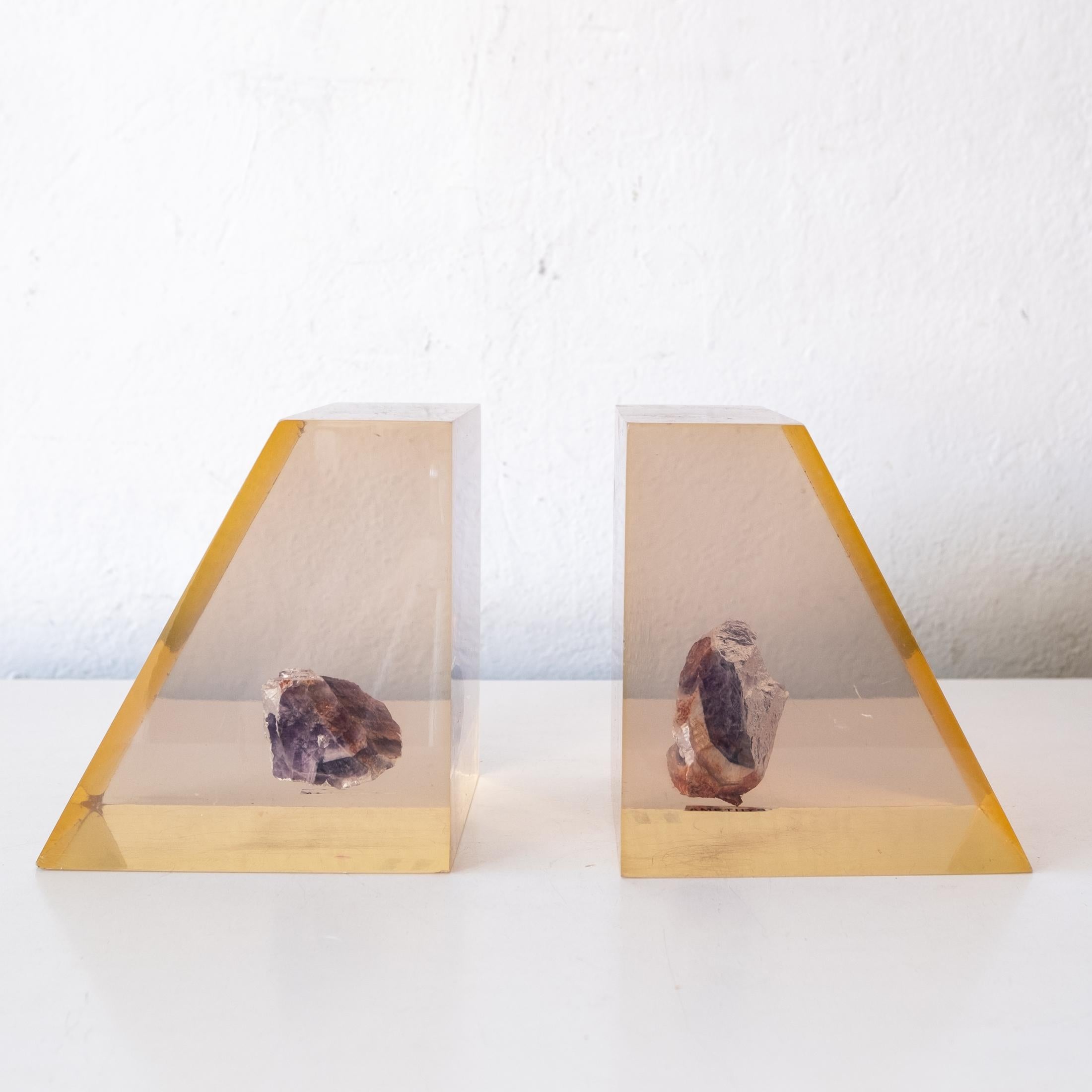 A pair of Amethyst Specimen lucite encased bookends from the 1970s. A unique statement piece.
