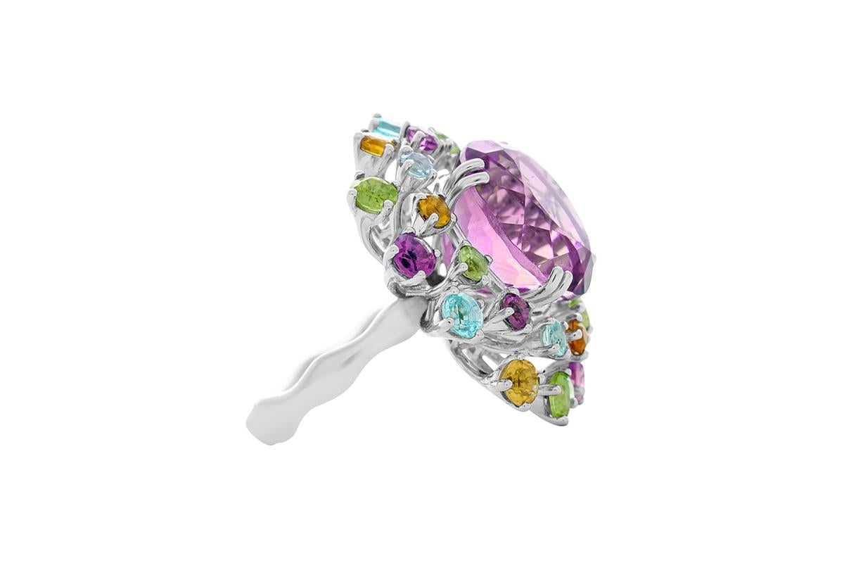 The beauty of a flower in a bold yet unequivocally feminine ring. A unique and only one available piece 18K white gold 
Amethyst: 
– Weight (total): 17.03 carats 
– Cut: Round brilliant 
Amethyst: 
– Weight (total): 1.05 carats 
– Cut: Round