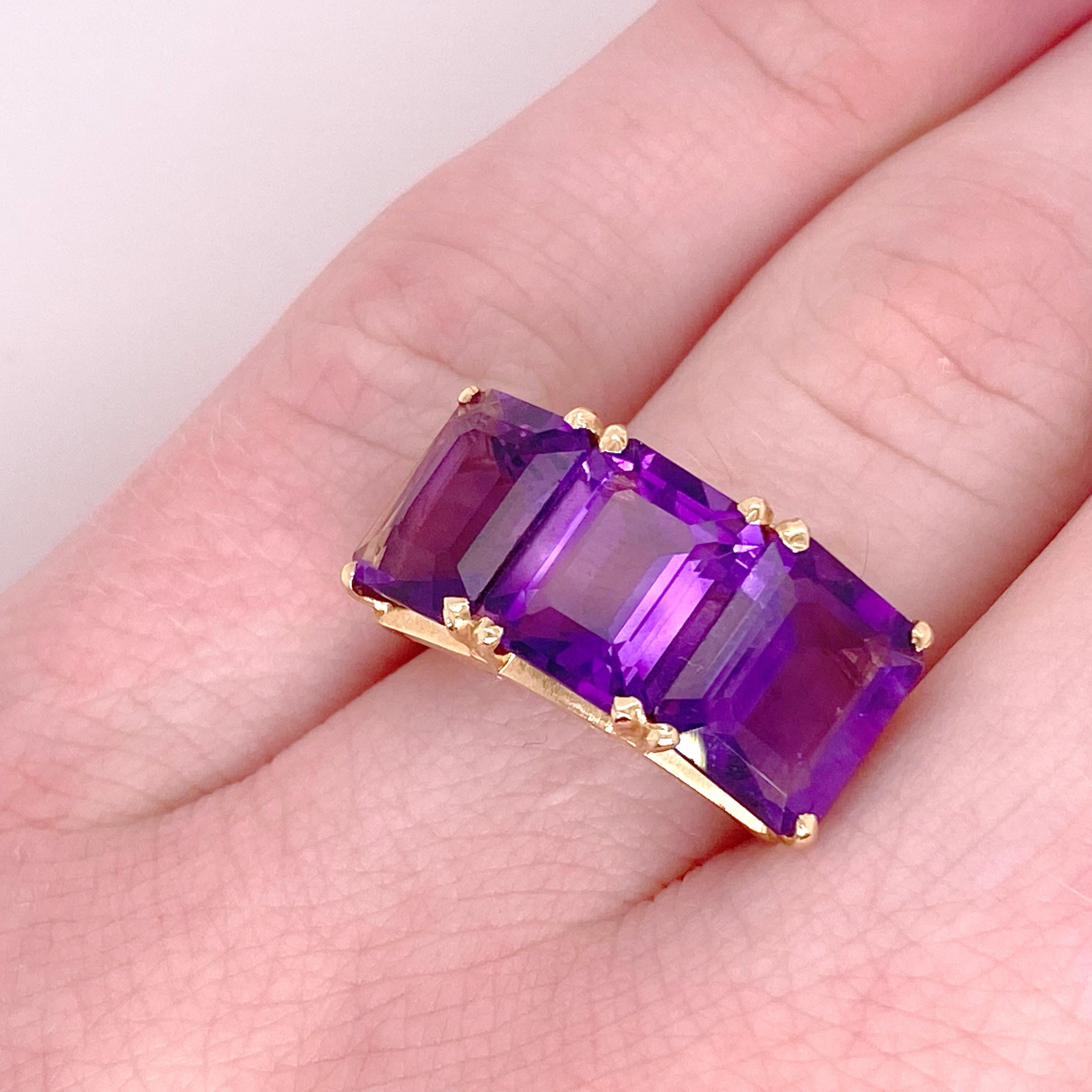 These three large amethysts are perfect and symmetrical in their emerald cut design. Together the three amethysts weigh over 7 carats. This ring is both a statement piece and it is incredibly comfortable to wear. The cathedral style undergallery