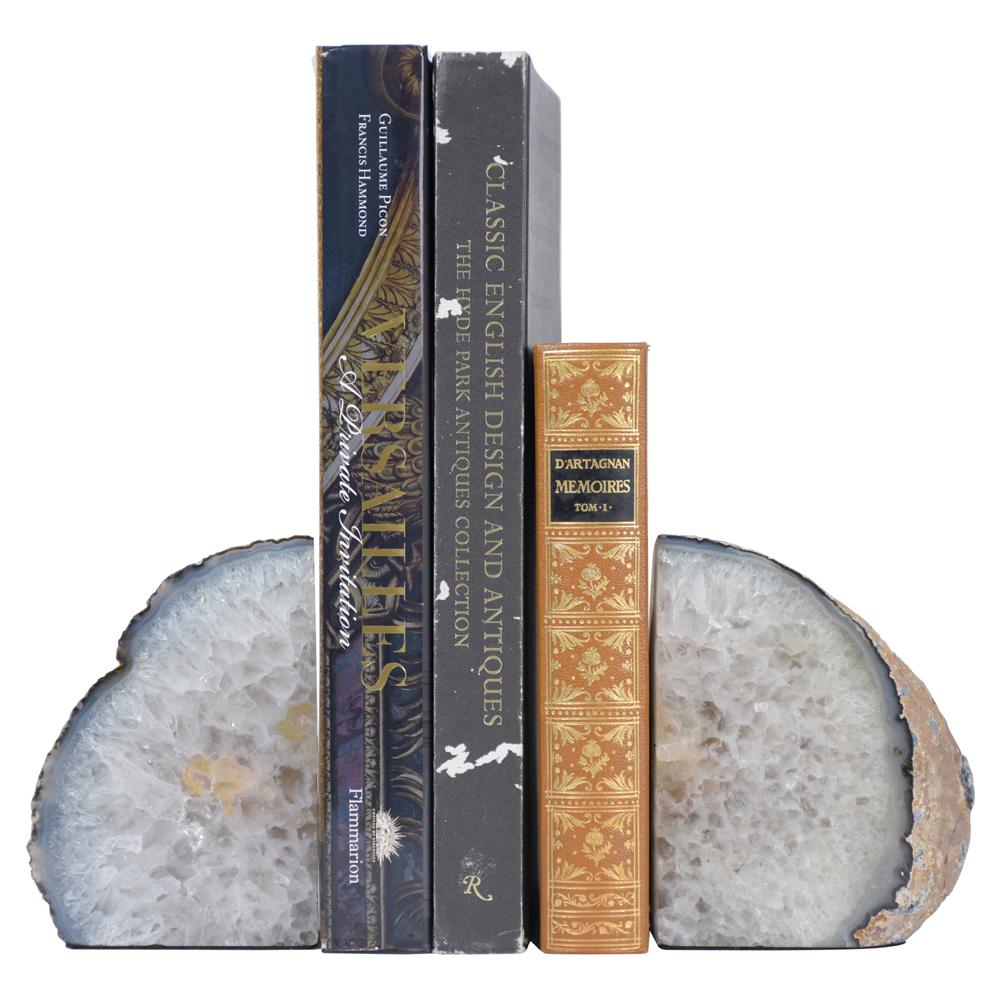 A pair of modern decorative bookends beautiful crafted out of amethyst stone. These bookends are eye-catching and a perfect addition to any office or home decor.