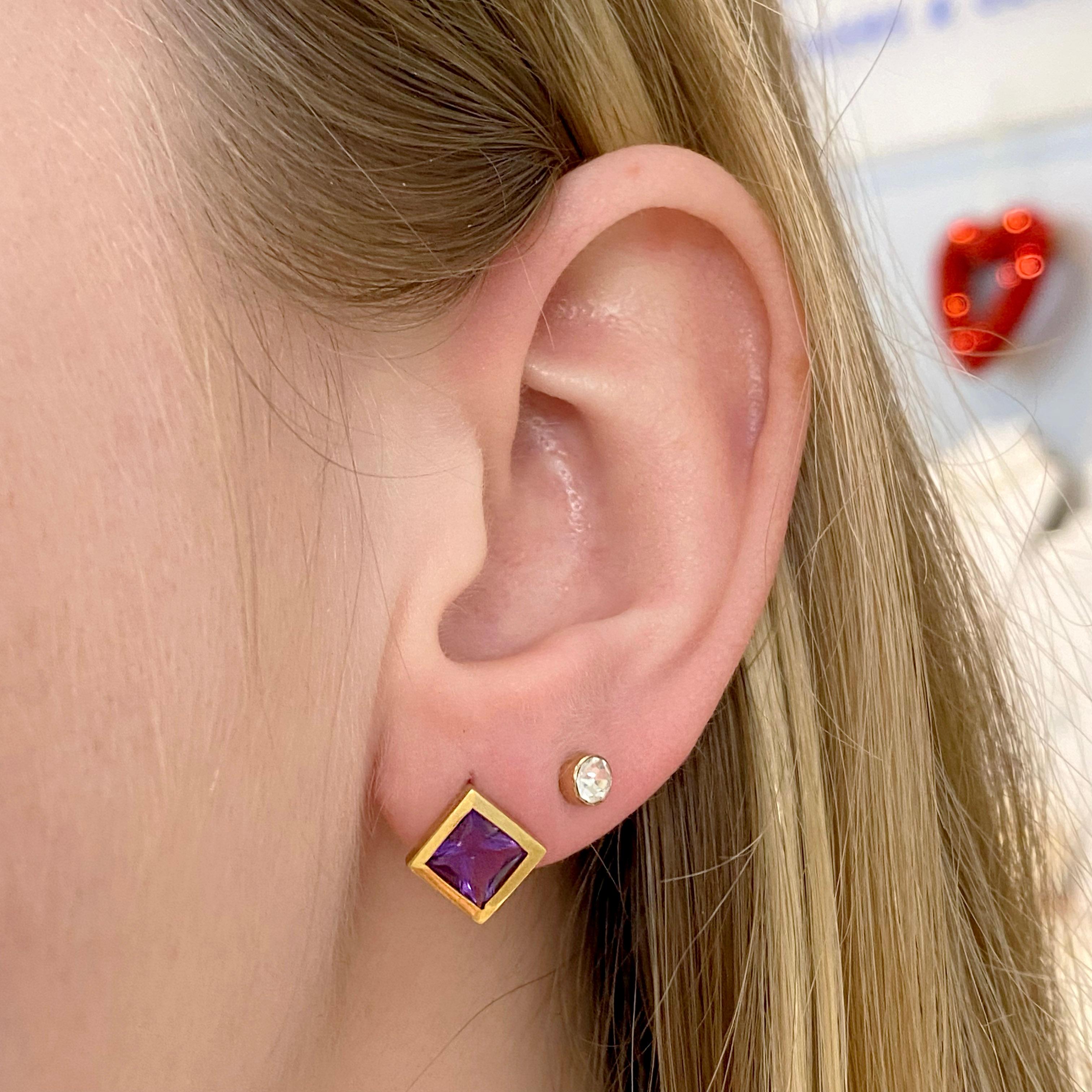 The contrast of the vibrant purple amethyst and bright yellow gold is strikingly beautiful and really complete your accessories! The 18k square shape bezel of these stud earrings make them so uniques. You will be surprised with the reasonable price.