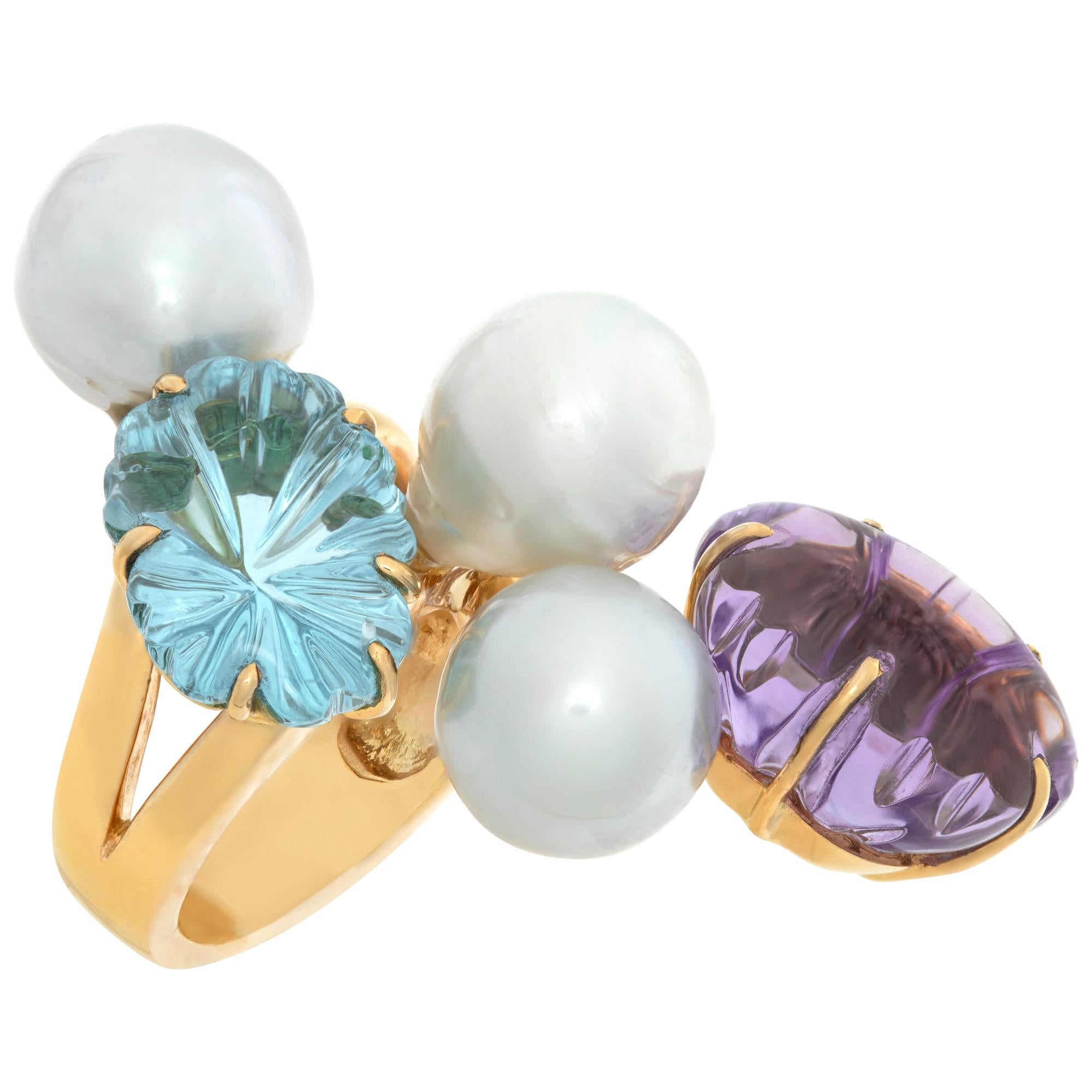Oval brilliant cut Amethyst & Blue Topaz (total approx. weight: 30.00 carats) ring with three off round South Sea Pearls (10 x 10.5 mm) ring in 18K yellow gold. Measurements: 1 3/4