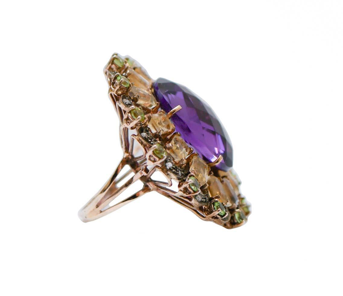Fantastic ring in 9 kt rose gold and silver structure mounted with a central hydrothermal amethyst surrounded by peridots, topaz and diamonds.
This ring was totally handmade by Italian master goldsmiths and it is in perfect conditions.
Diamonds 0.27
