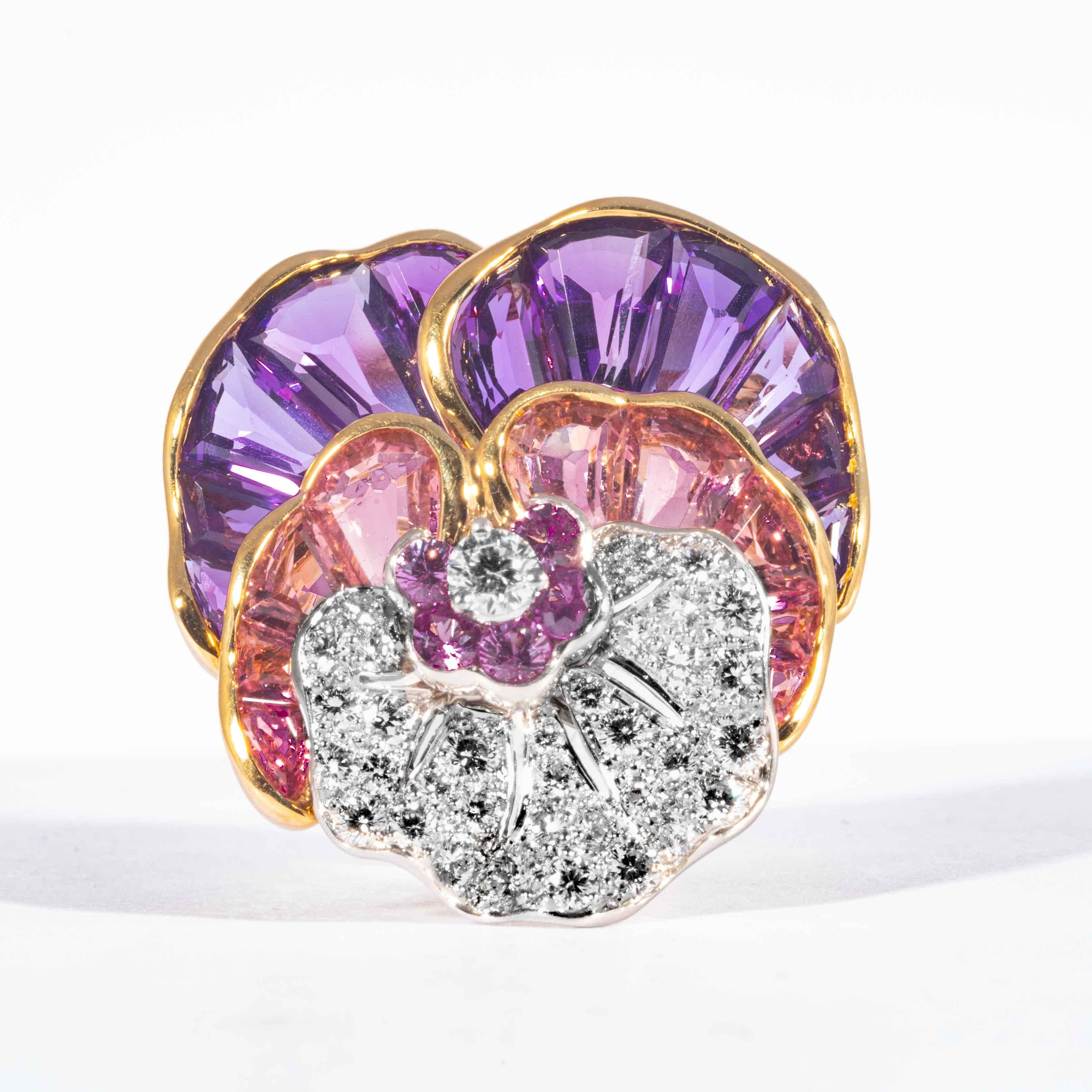 Purple Amethyst, Pink Topaz, Purplish Magenta Tourmaline, and sparkling white diamonds come together in a beautiful display of color to form a unique rendition of Oscar Heyman Brother's icon pansy pin. Created in 18kt yellow gold and platinum. This