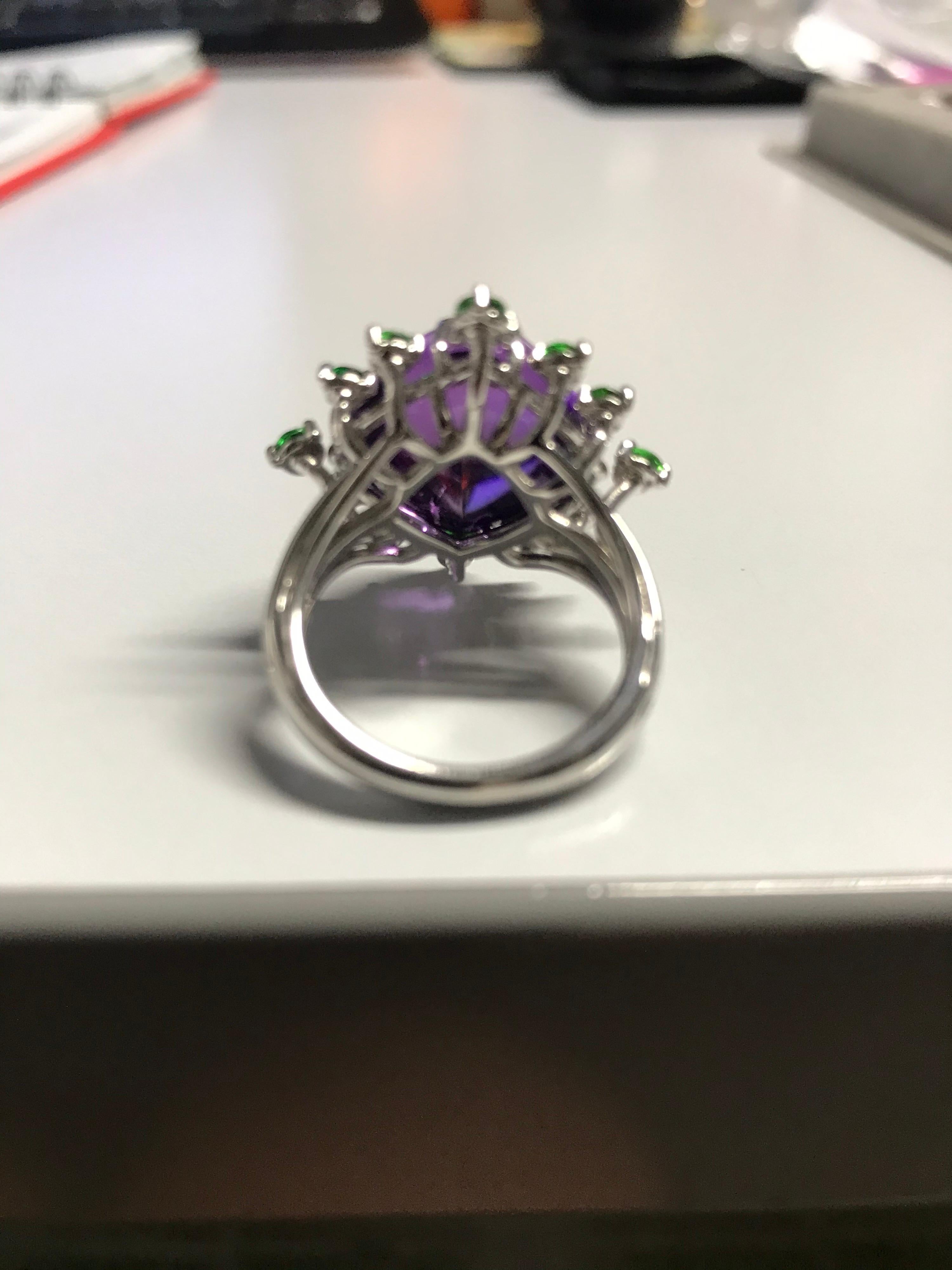 Handcrafted in Margherita Burgener family workshop, based in Valenza,  Italy, in 18KT white gold, the ring is centering the February birthstone Amethyst in a original sugar loaf cut.

18KT white gold grams 7.03
n. 1 Amethyst  ct 13.98 
n. 12