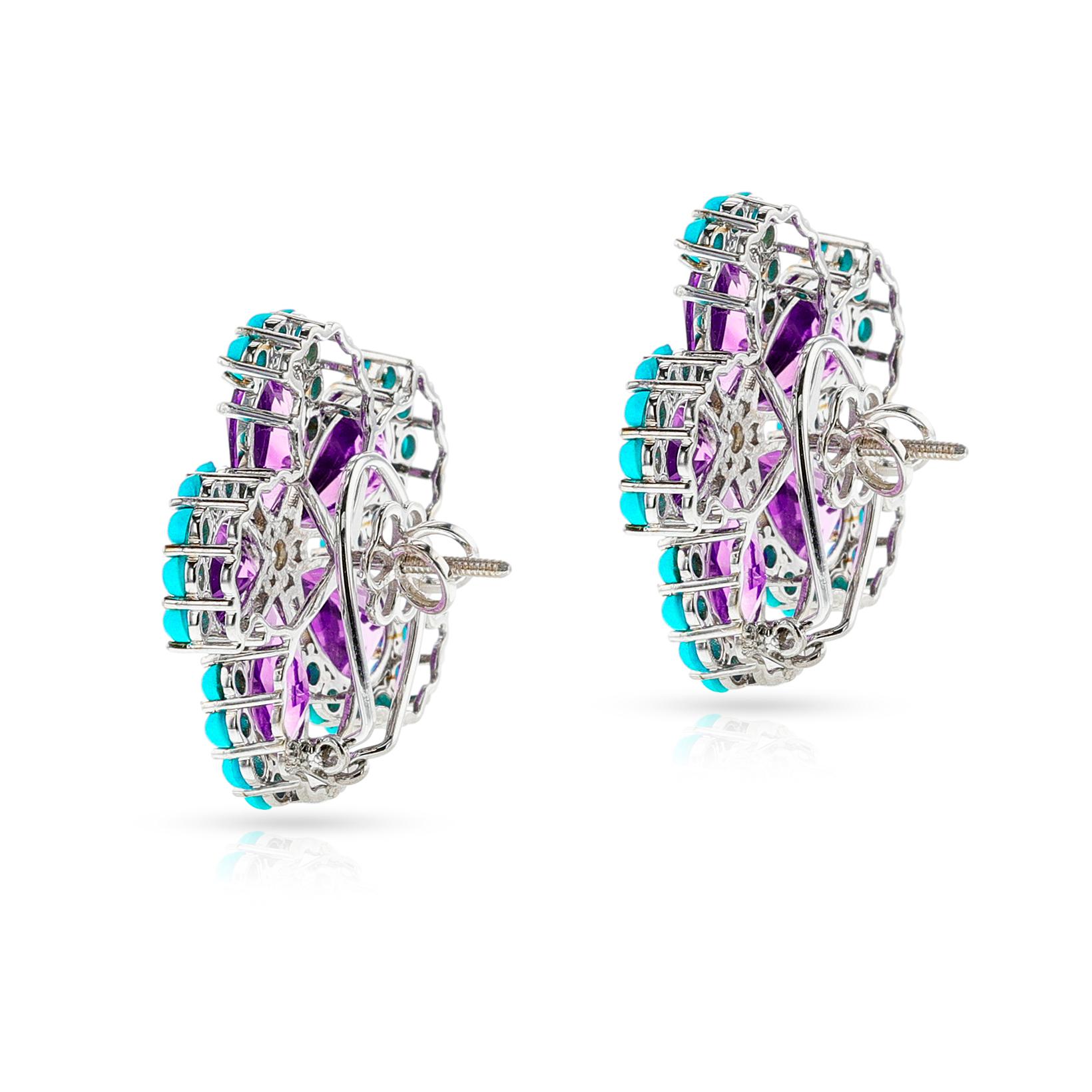A pair of Amethyst, Turquoise Cabochon, and Diamond Floral Earrings, 18k White Gold. The amethyst and turquoise weigh 26.4 carats. The diamonds weigh appx. 0.30 carats. The total weight of the earring is 20.35 grams.  The length is 1.10