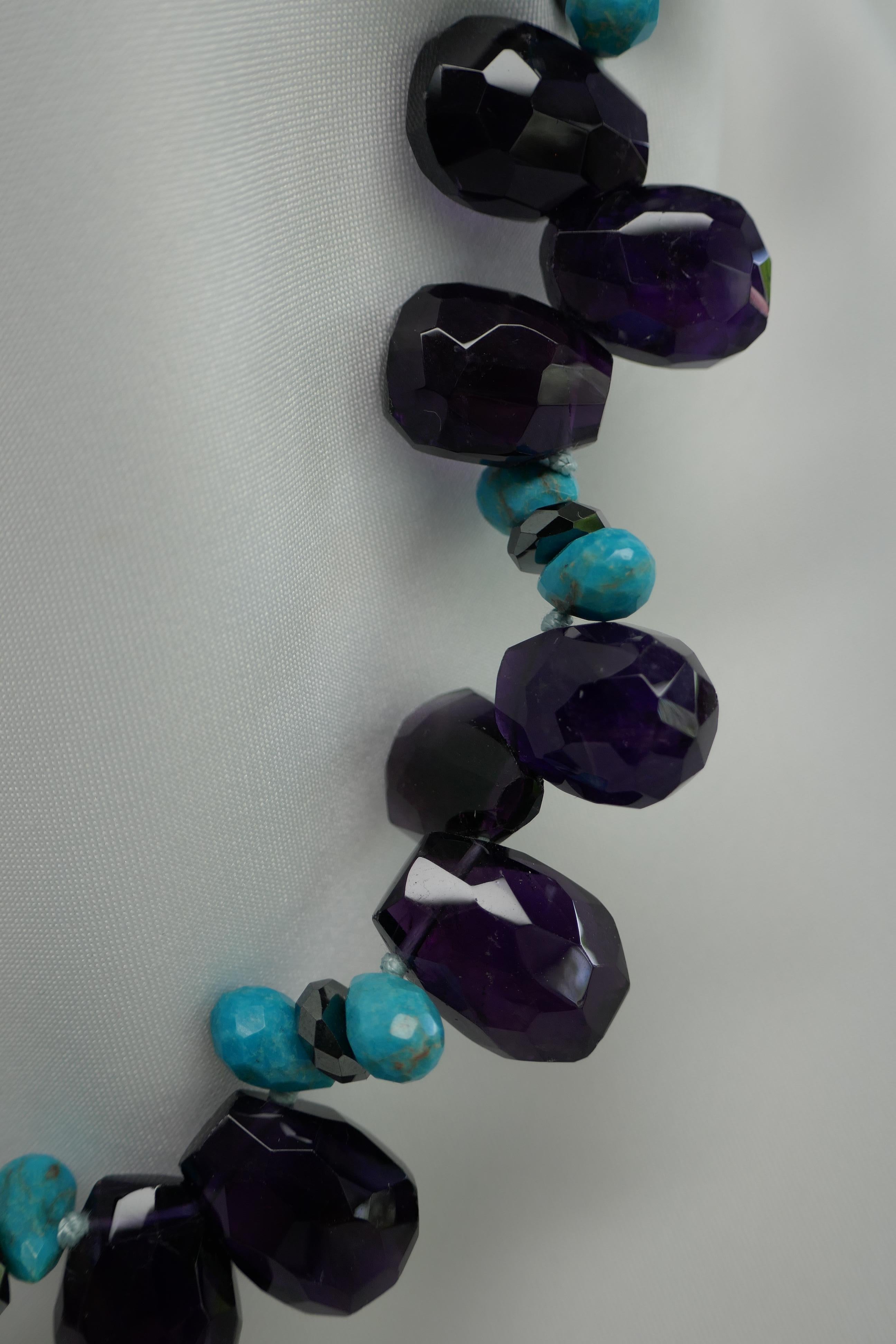 I love the combination of amethyst and turquoise. The true color of the amethyst is difficult to capture and comes out too dark. But the necklace is stunning. The combination of the dark faceted amethyst drop shape 14mm x 18mm with faceted turquoise