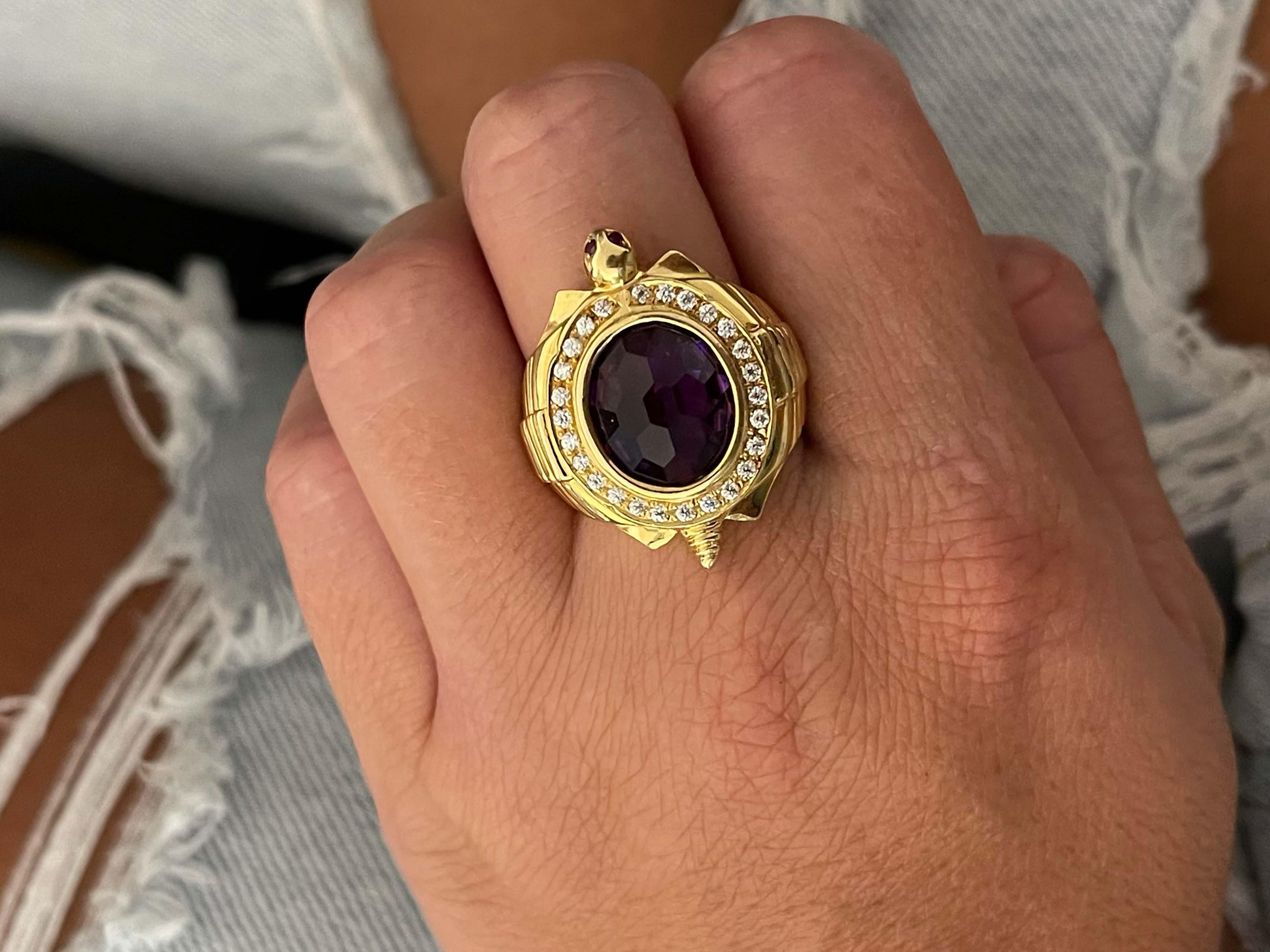 Ring Specifications:

Metal: 18k Yellow Gold

Total Weight: 17.3 Grams
�​
Cubic Zirconia Count: 26
​
​Gemstone: 1 purple amethyst
​
​Amethyst carat Weight: ~4.5 carats

Ring Size: 8.5 (resizable)

Stamped: 