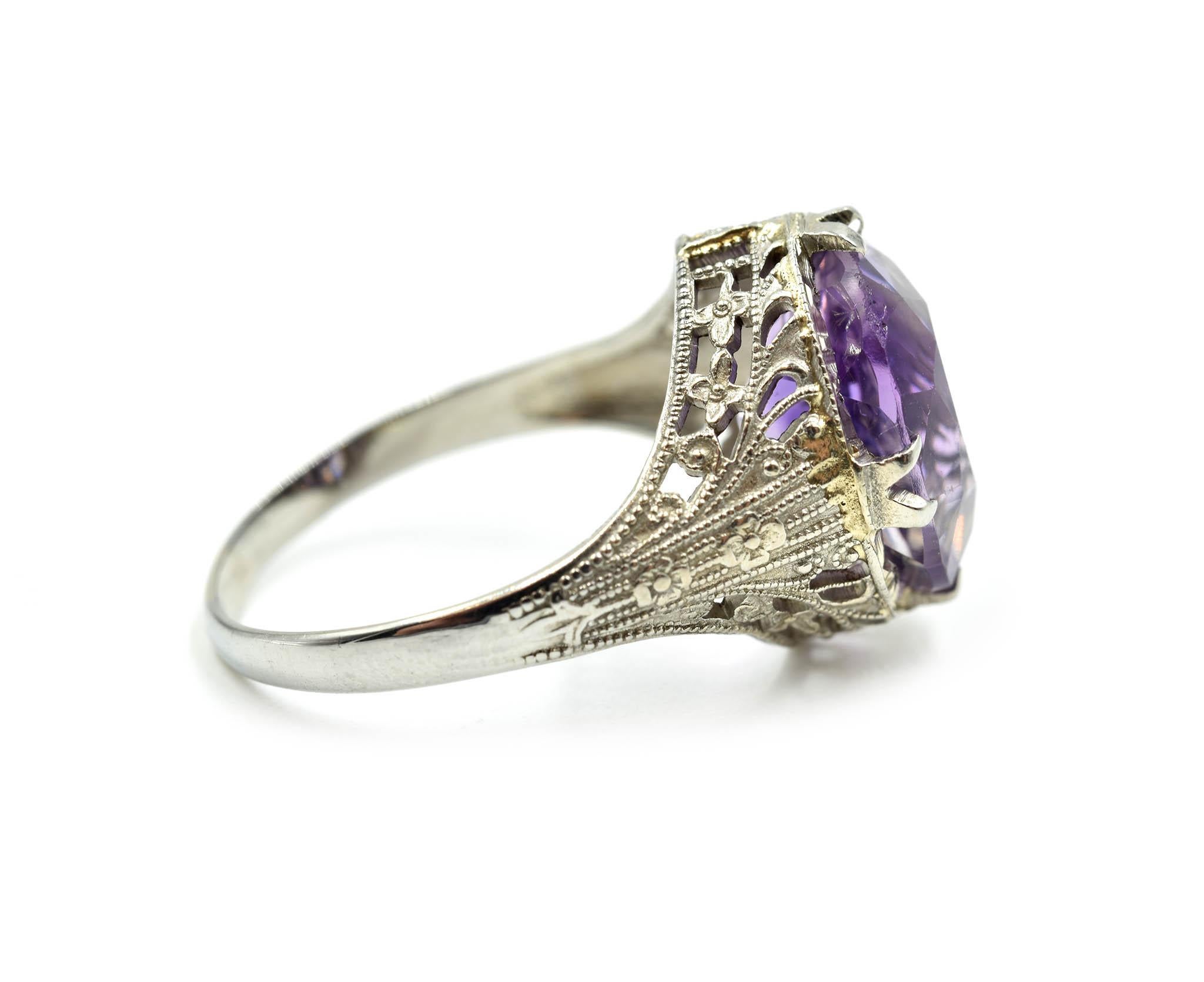 Designer: custom design
Material: 18k white gold
Amethyst: oval cut amethyst 4.52 carat weight
Dimensions: ring top is 13.51mm long and 11.50mm wide
Ring Size: 7
Weight: 3.74 grams
