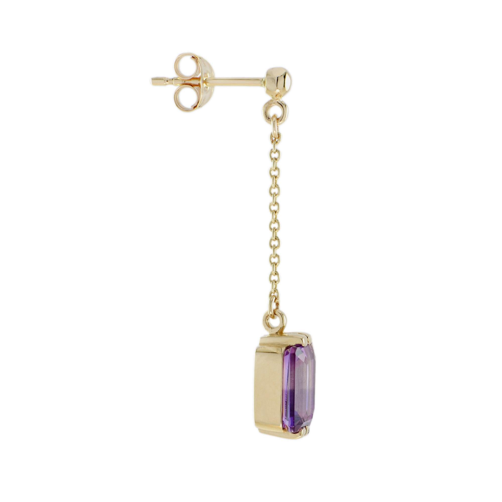 A lovely emerald cut amethyst gemstones cast a chic on these dramatic linear dangle earrings.

Earrings Information
Metal: 9K Yellow Gold
Width: 6 mm.
Length: 33 mm.
Weight: 2.93 g. (approx. in total)
Backing: Push Back

Center Gemstones 
Type:
