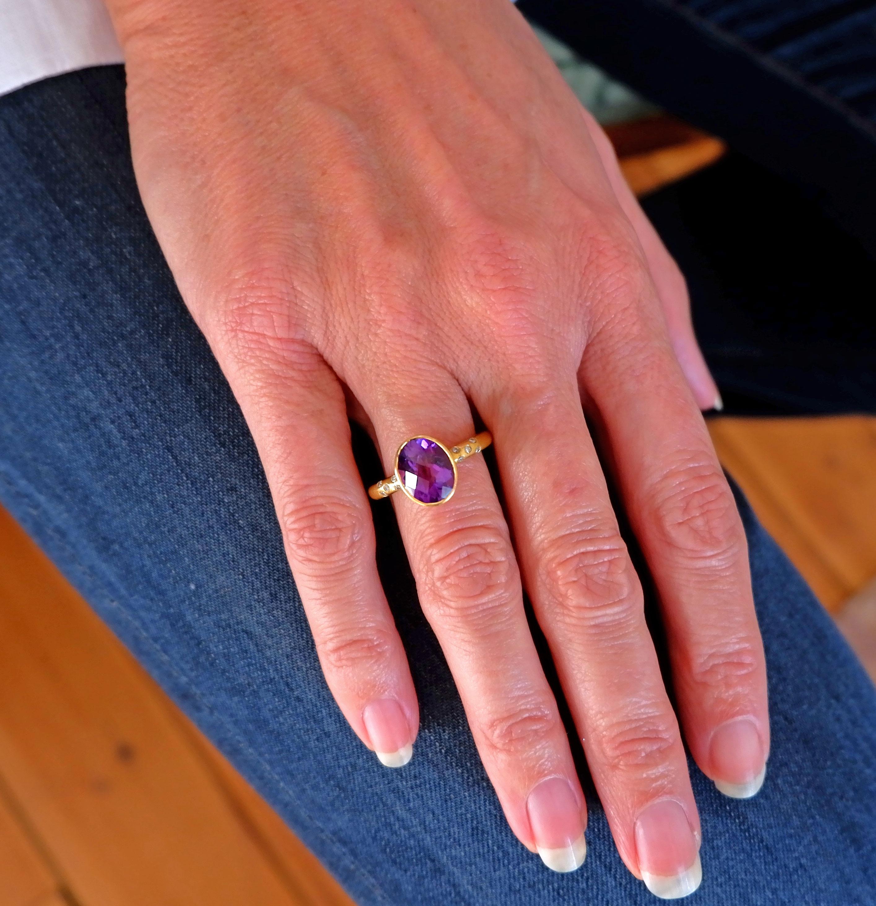 A chic, hand crafted 18 karat matte gold ring from India with an oval cut amethyst and ten diamonds. Size: UK O/P US 7.6 Europe 55.5. The ring can be resized. Wear it with or Fluorite, gold and diamond ring.