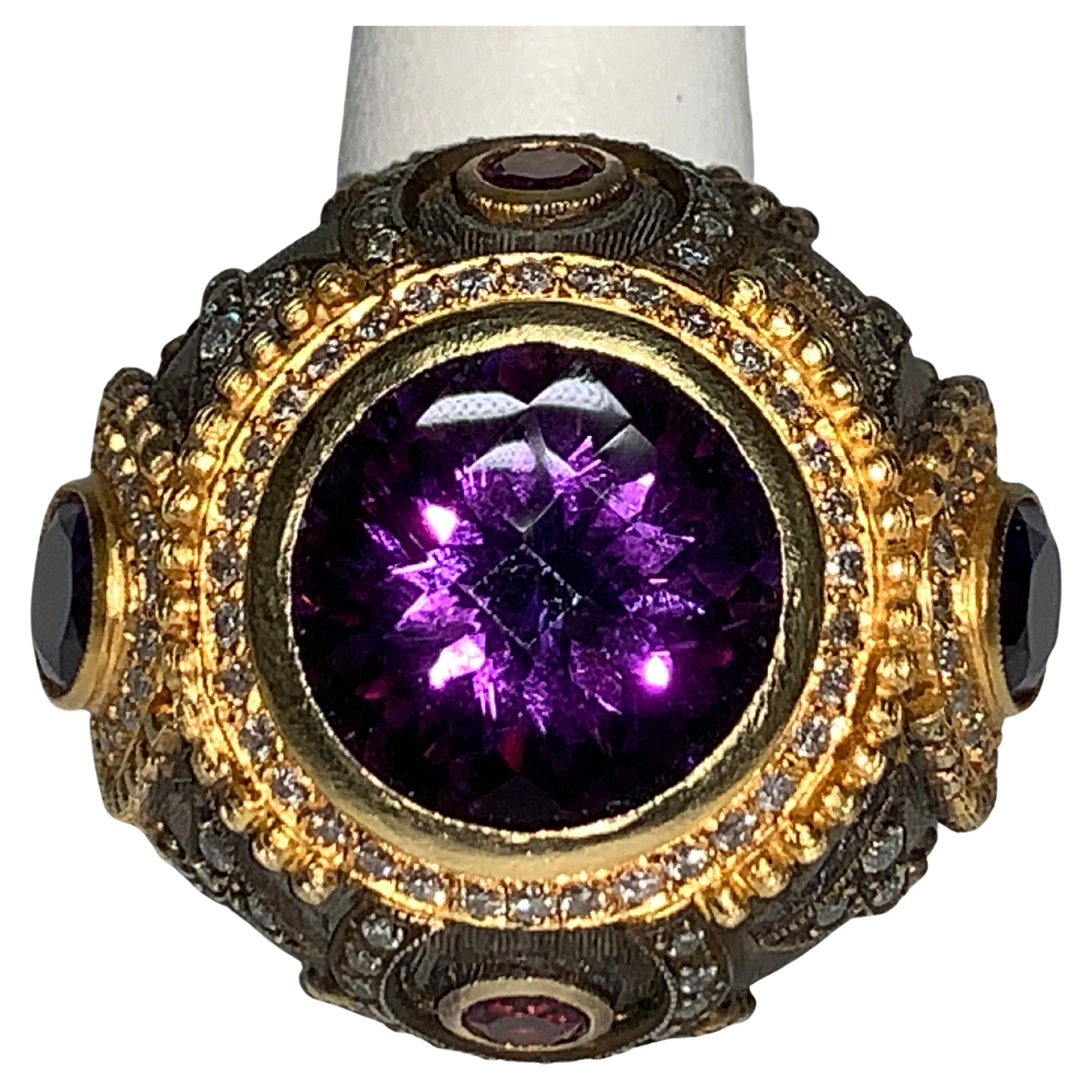 Amethyst, White Diamond Ring, 16.30 Carats

Featuring an exquisite 14.5 Carat Amethyst Stone; accented Round White Diamonds, a total weight of 1.80 Carats, set in 18K Yellow Gold & Oxidized Sterling Silver.  Total weight of 16.30 Carats

Size 7.5,