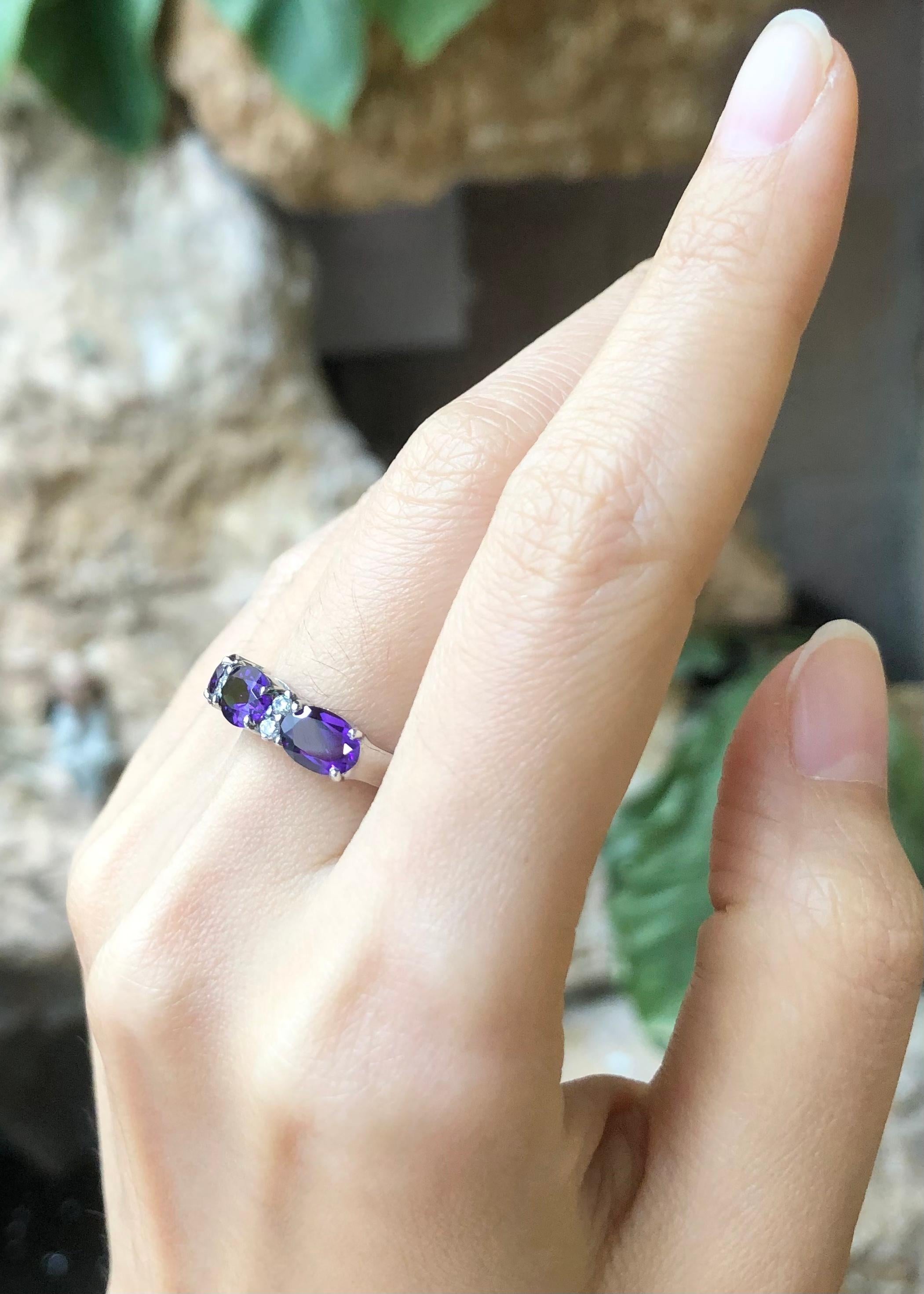 Amethyst with Cubic Zirconia Ring set in Silver Settings

Width:  2.1 cm 
Length: 0.5 cm
Ring Size: 53
Total Weight: 3.07 grams

*Please note that the silver setting is plated with rhodium to promote shine and help prevent oxidation.  However, with