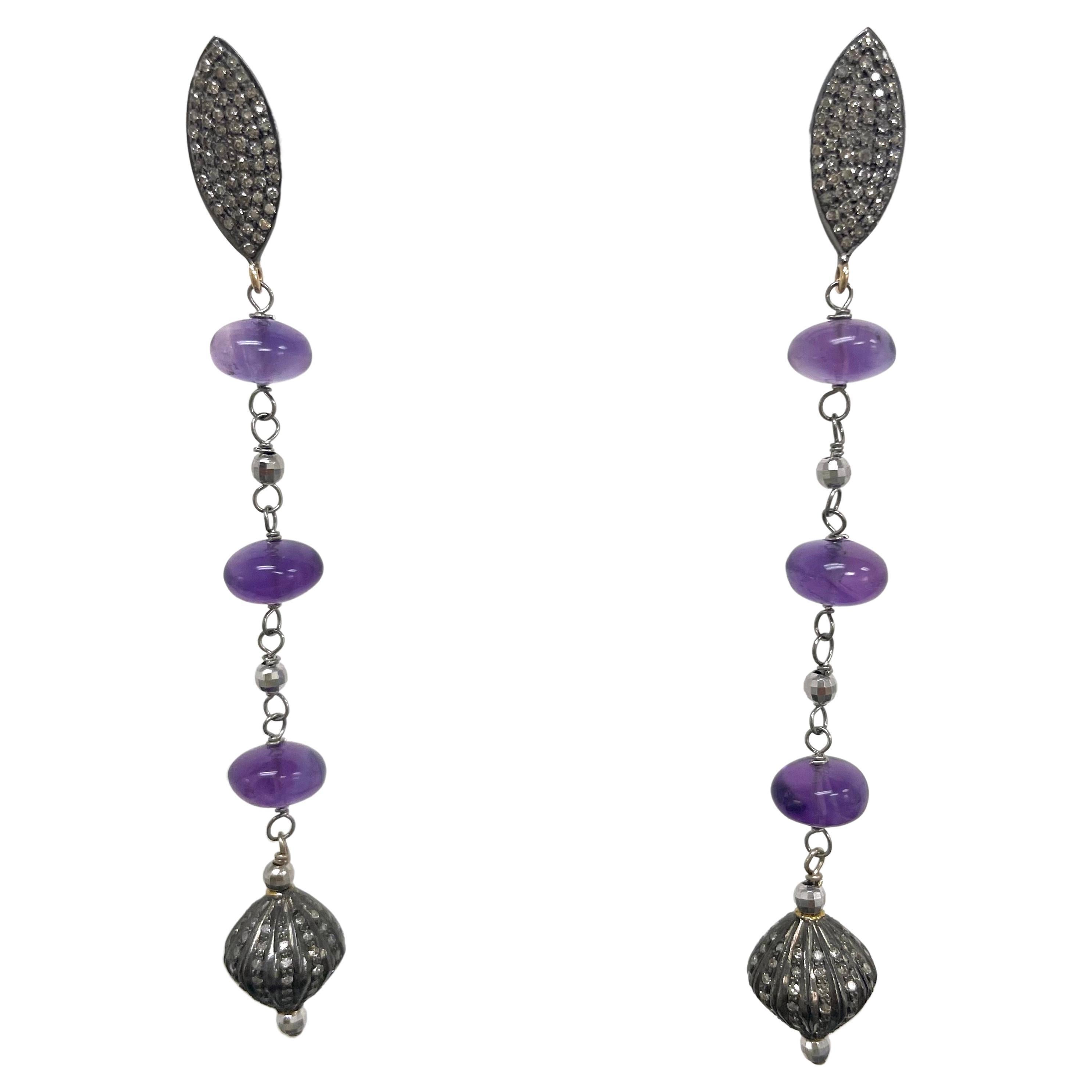 Description
Elegant statement Amethyst dangle earrings with pave diamond drops and marquise shape diamond studs.
Item # E3228

Materials and Weight
Amethyst, 18 carats, 9mm, smooth rondelle shape
Pave diamonds studs with gold posts and jumbo