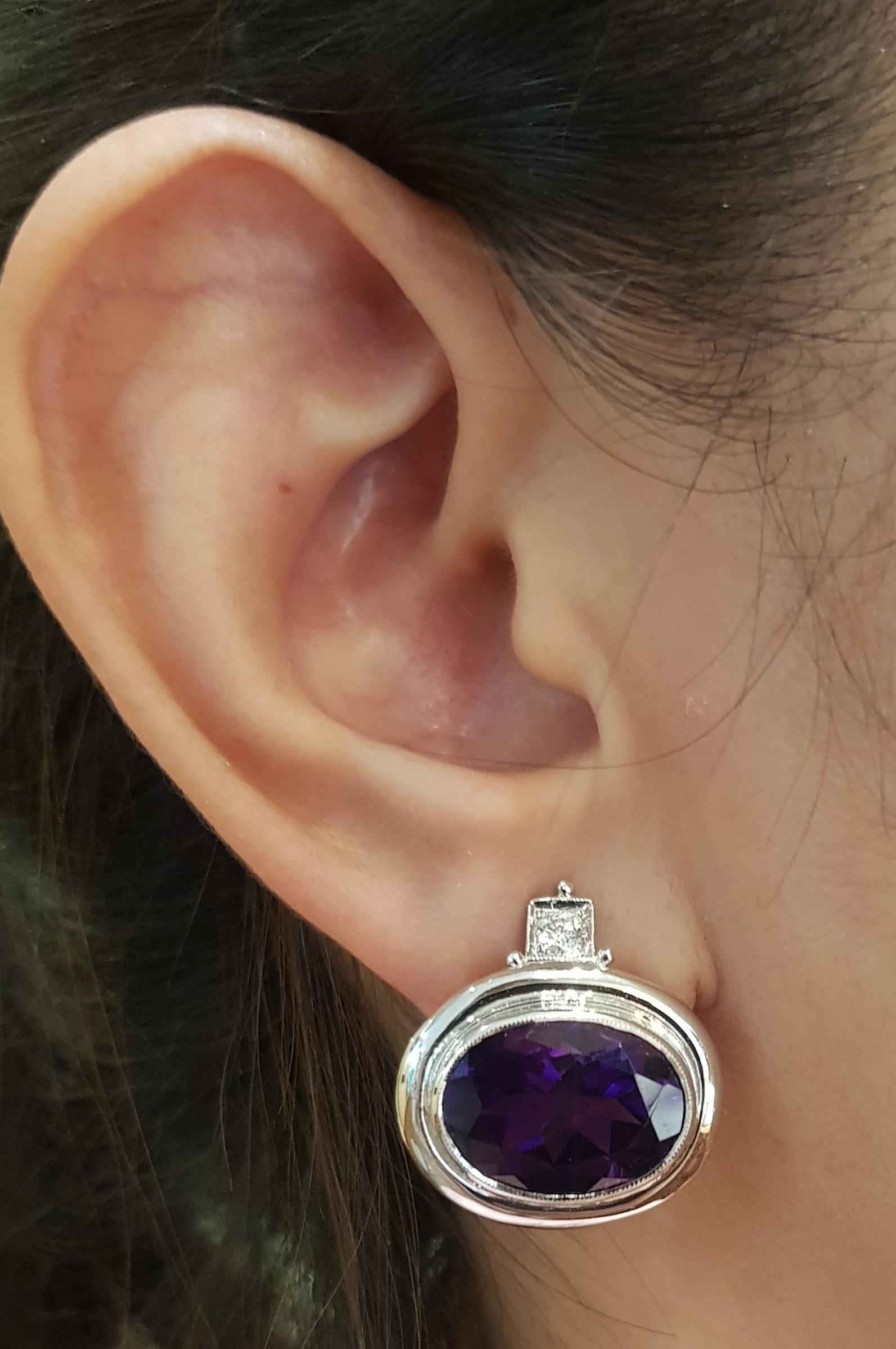 Amethyst 15.09 carats with Diamond 0.26 carat Earrings set in 18 Karat White Gold Settings

Width: 2.0 cm 
Length:  2.2 cm
Total Weight: 14.74 grams

