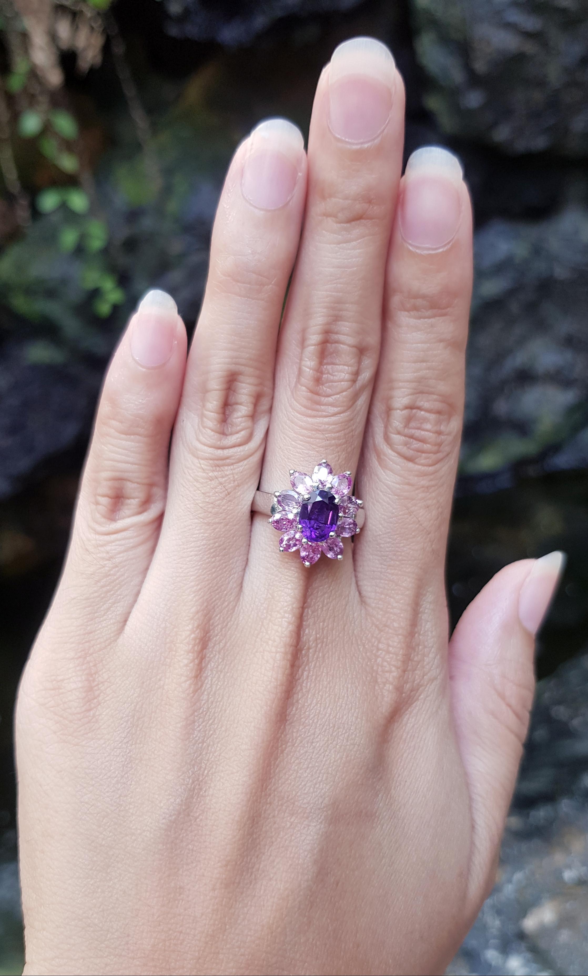Amethyst with Pink Sapphire Ring set in Silver Settings

Width:  1.5 cm 
Length: 1.7 cm
Ring Size: 56
Total Weight: 5.23 grams

*Please note that the silver setting is plated with rhodium to promote shine and help prevent oxidation.  However, with
