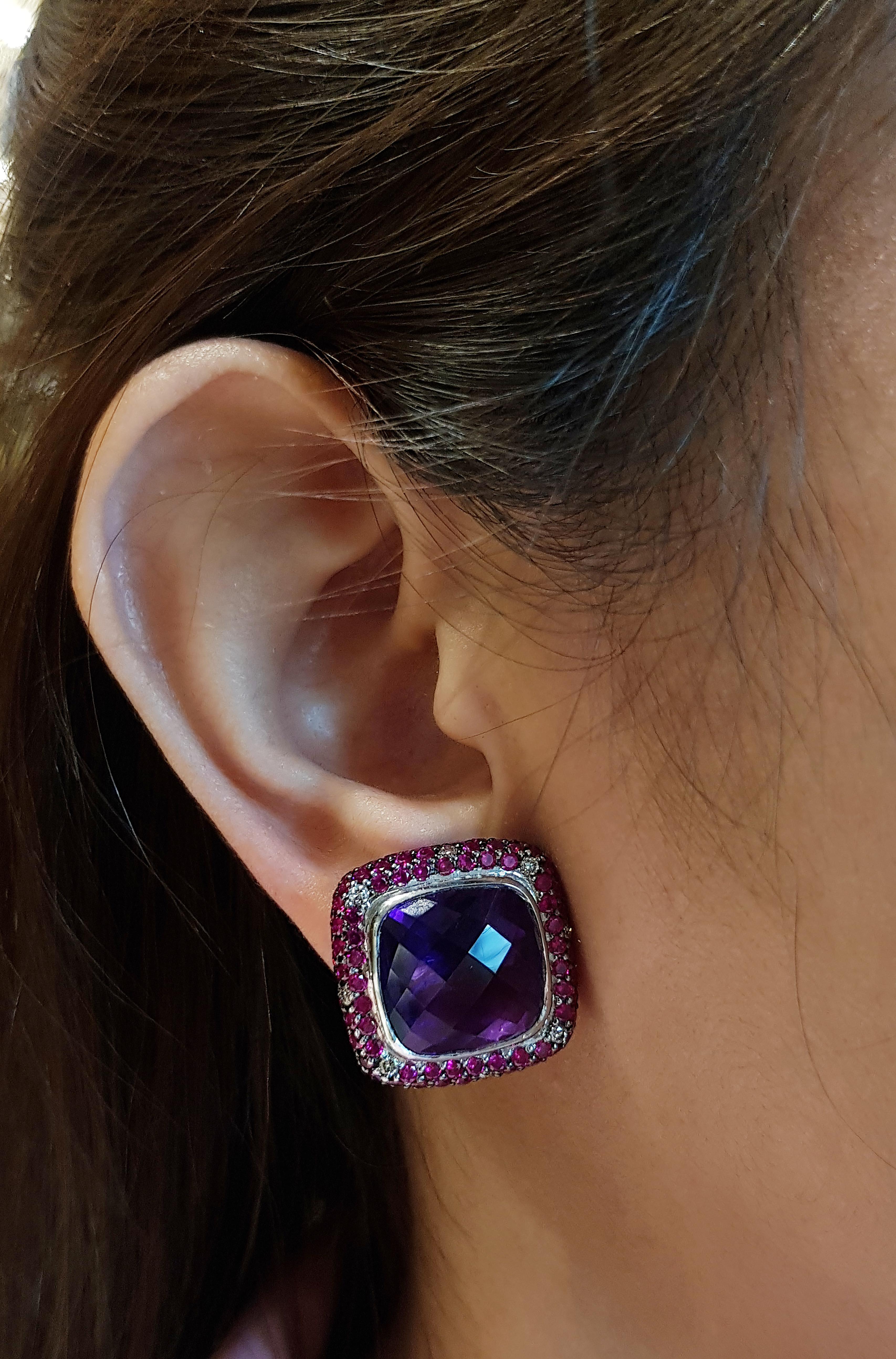 Amethyst 20.27 carats with Ruby 3.84 carats and Brown Diamond 0.30 carat Earrings set in 18 Karat White Gold Settings

Width:  2.0 cm 
Length: 2.0 cm
Total Weight: 21.29 grams

