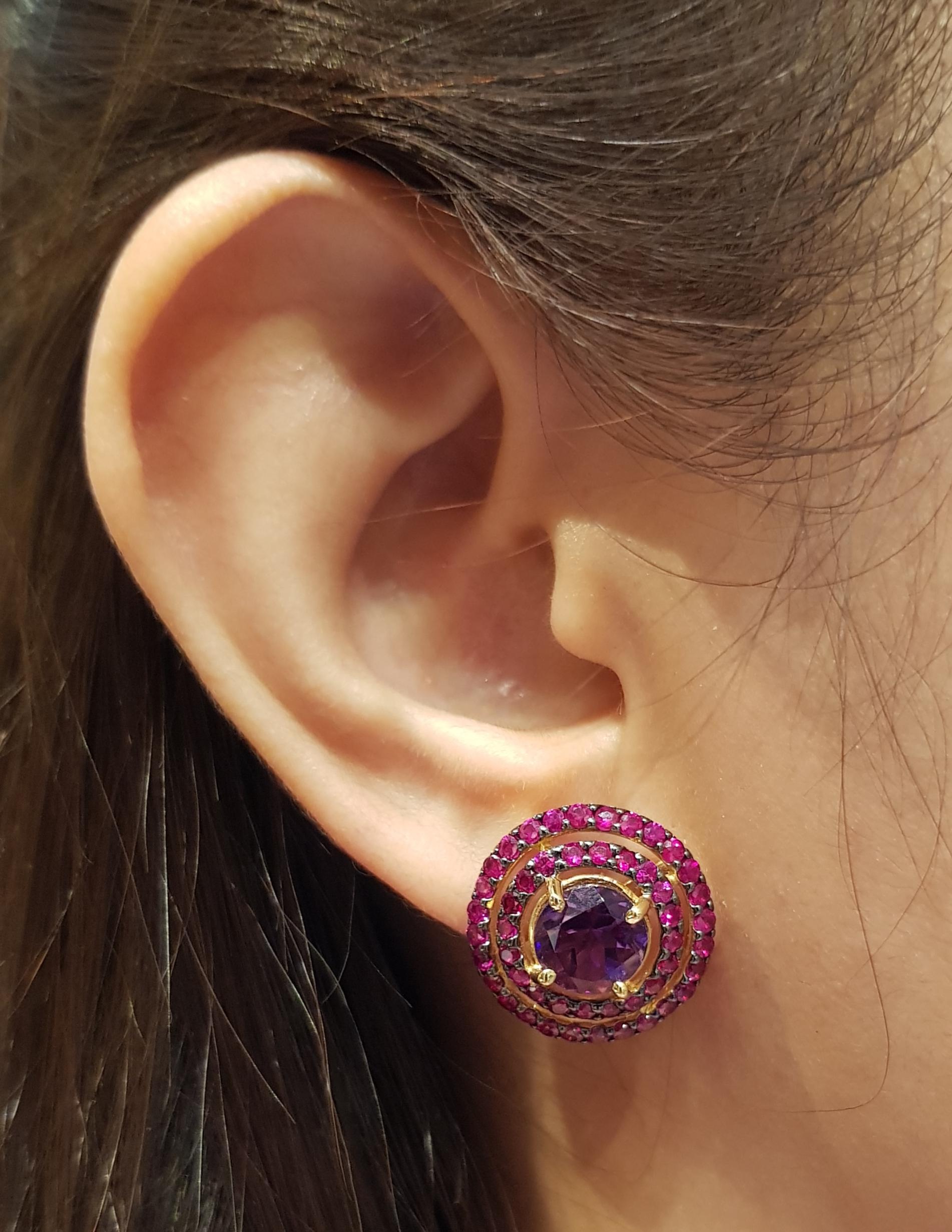 Amethyst 3.91 carats with Ruby 3.62 carats Earrings set in 18 Karat Gold Settings

Width:  1.9 cm 
Length: 1.9 cm
Total Weight: 9.68 grams

